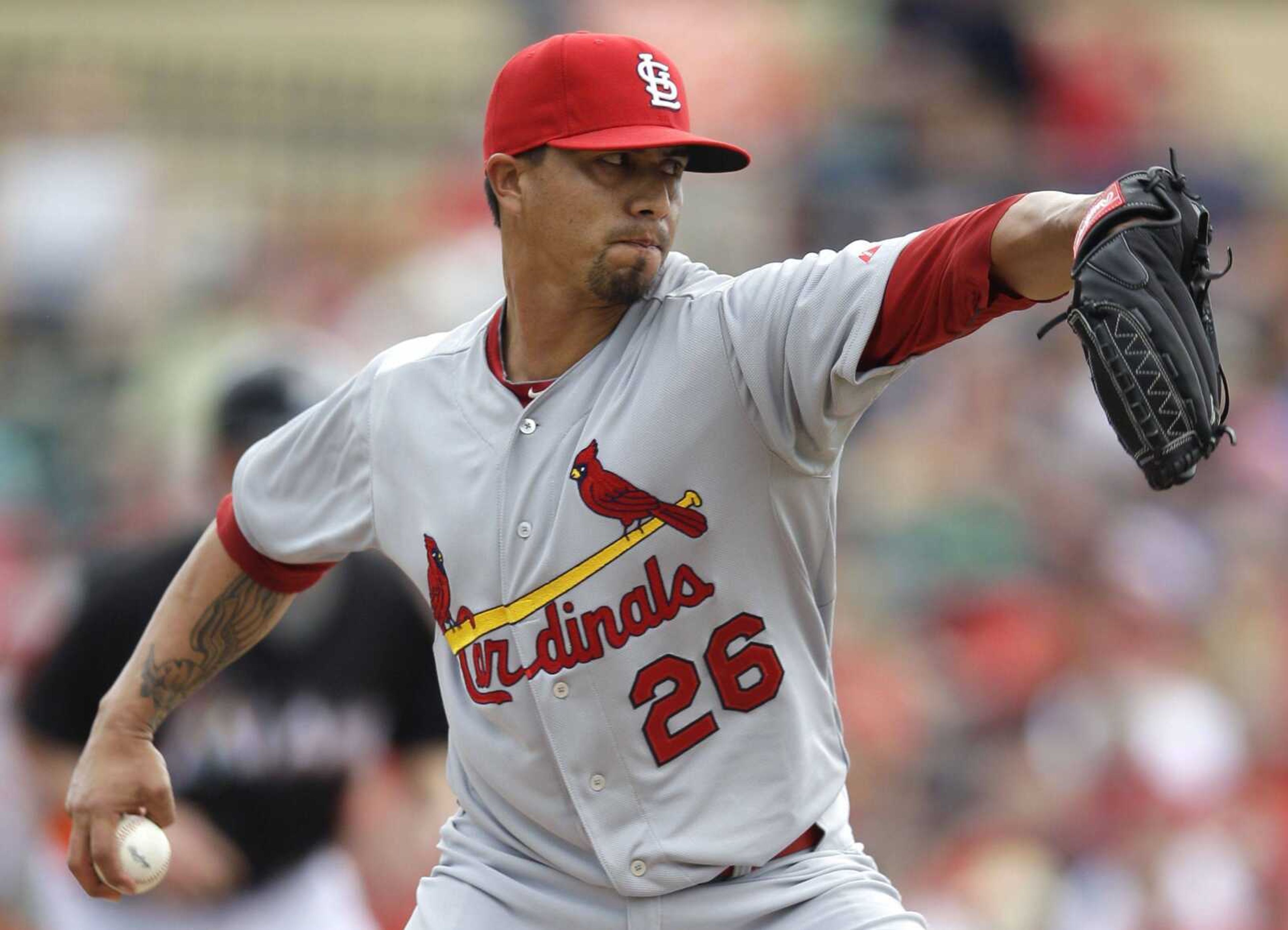 Cardinals starting pitcher Kyle Lohse delivers against the Marlins during the first inning Saturday in Jupiter, Fla. (PATRICK SEMANSKY ~ Associated Press)