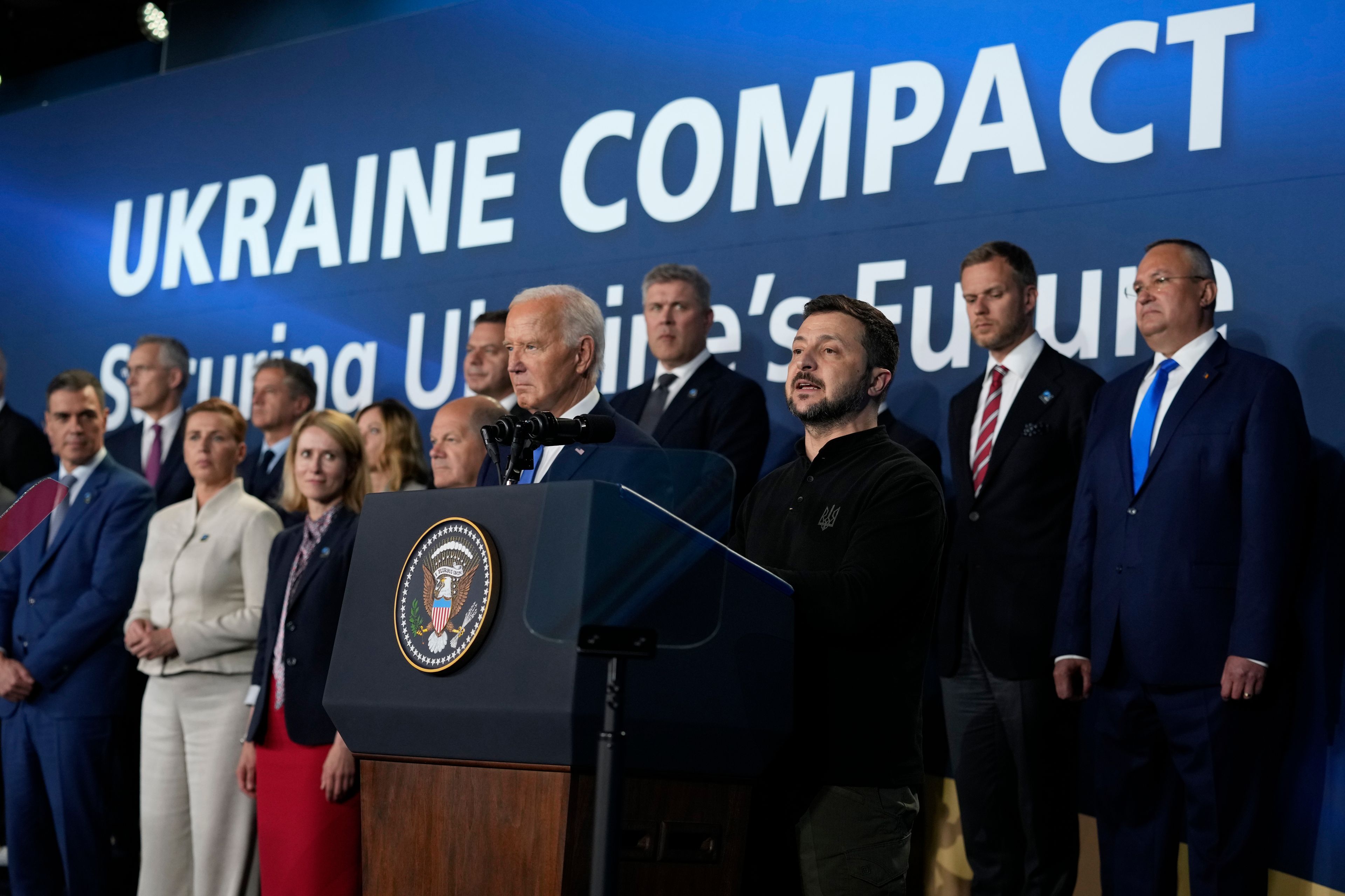 FILE - President Joe Biden, center left, and Ukrainian President Volodymyr Zelenskyy, center right, speak at an event with NATO leaders on the sidelines of the NATO Summit in Washington on July 11, 2024. (AP Photo/Susan Walsh, File)