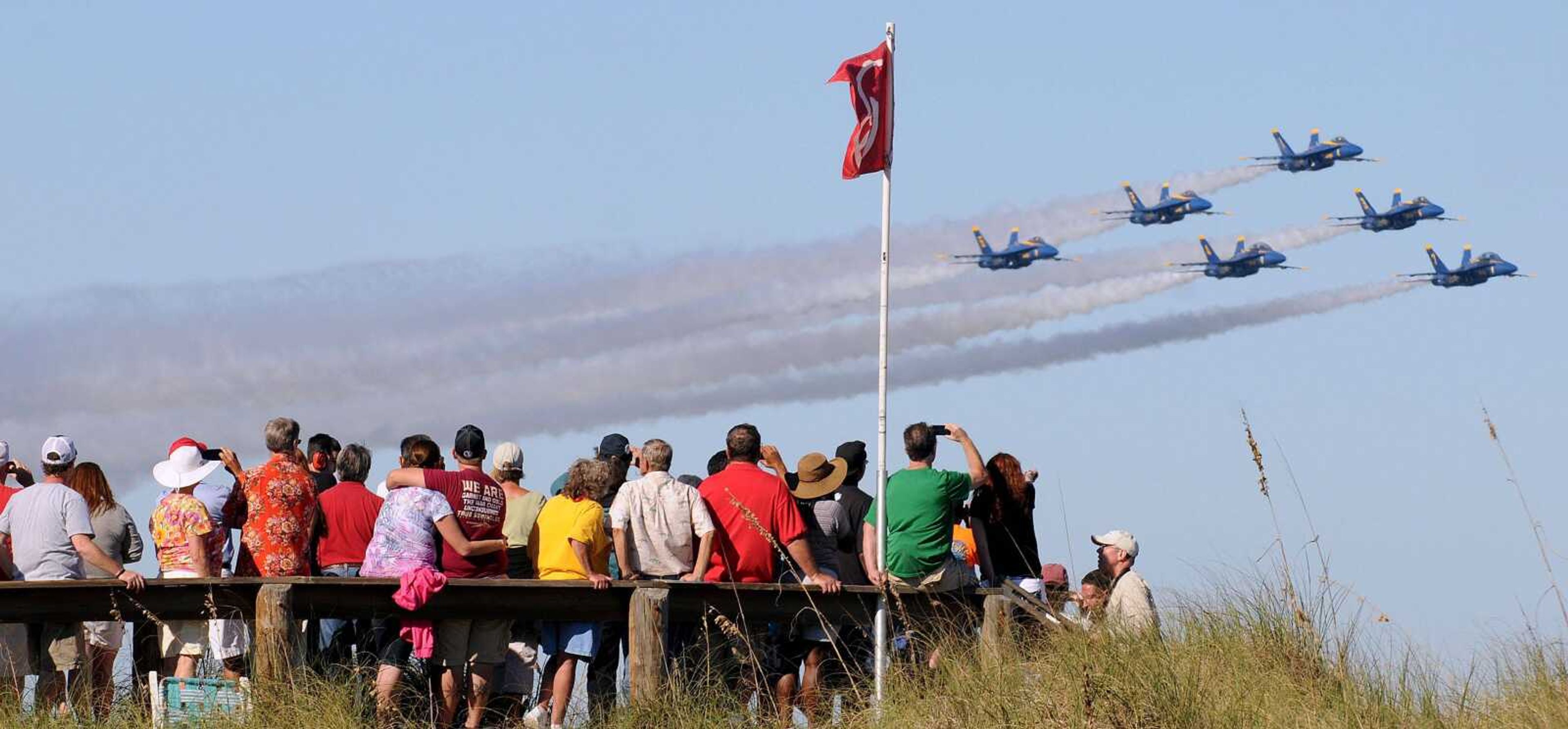 The U.S. Navy&#8217;s Blue Angels fly in formation above a crowd of spectators at the Jacksonville Sea and Sky Spectacular on Oct. 21, 2012, in Jacksonville Beach, Fla. (Associated Press file)