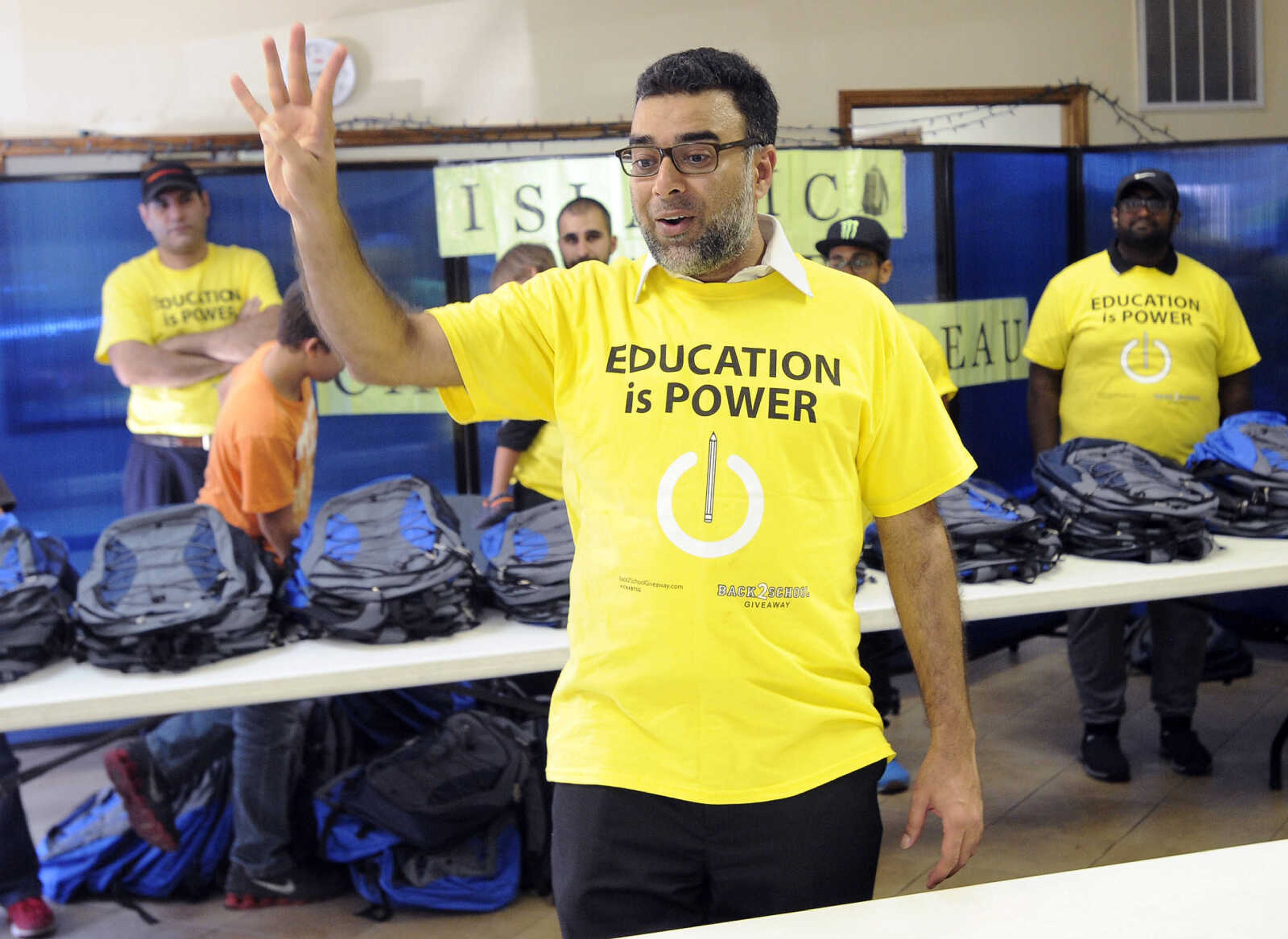 FRED LYNCH ~ flynch@semissourian.com
Ahmad Sheikh gives instructions for the backpack distribution Friday, Aug. 4, 2017 at the Islamic Center of Cape Girardeau.