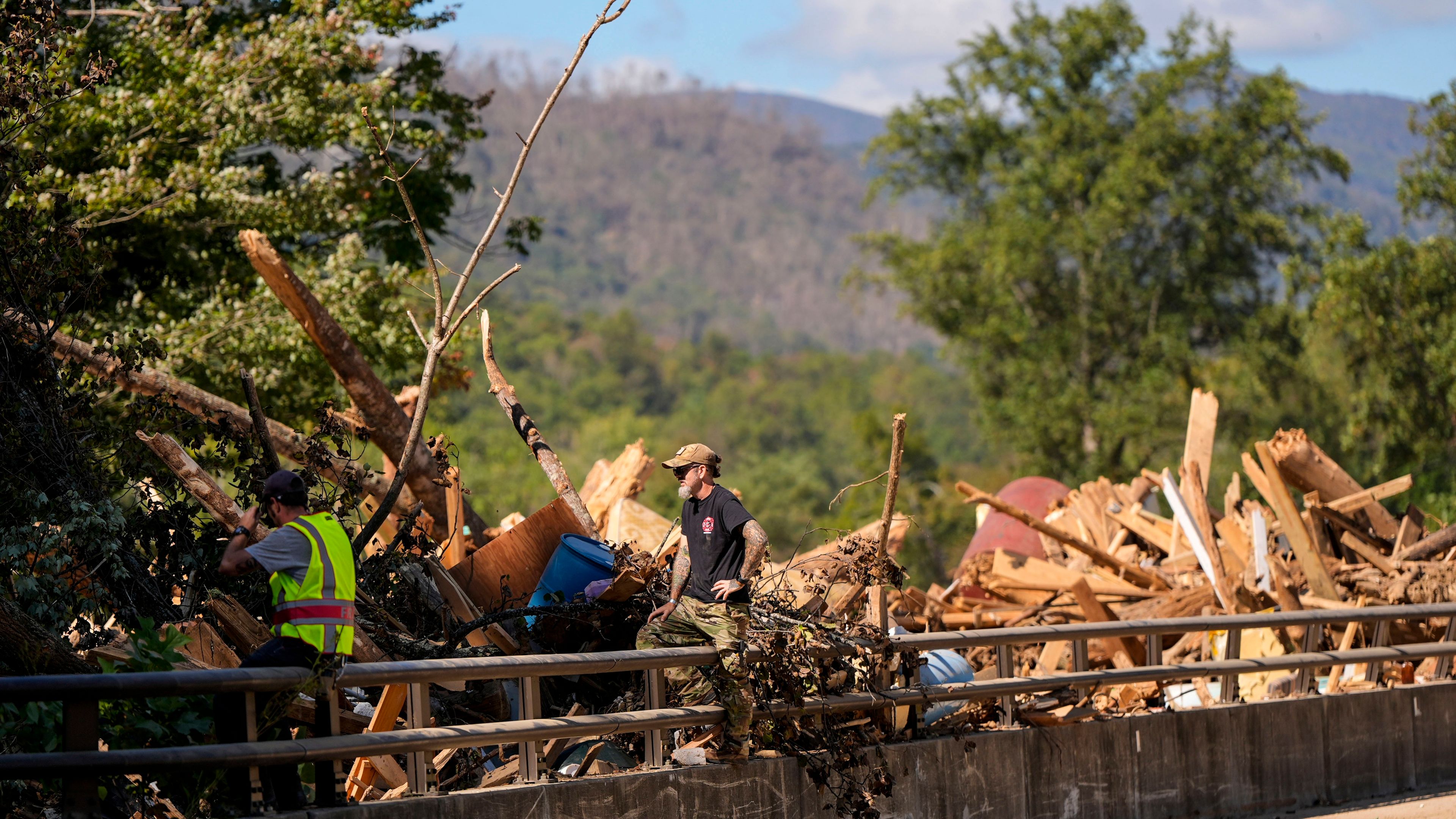 Debris rests on a bridge in the aftermath of Hurricane Helene, Wednesday, Oct. 2, 2024, in Chimney Rock Village, N.C. (AP Photo/Mike Stewart)