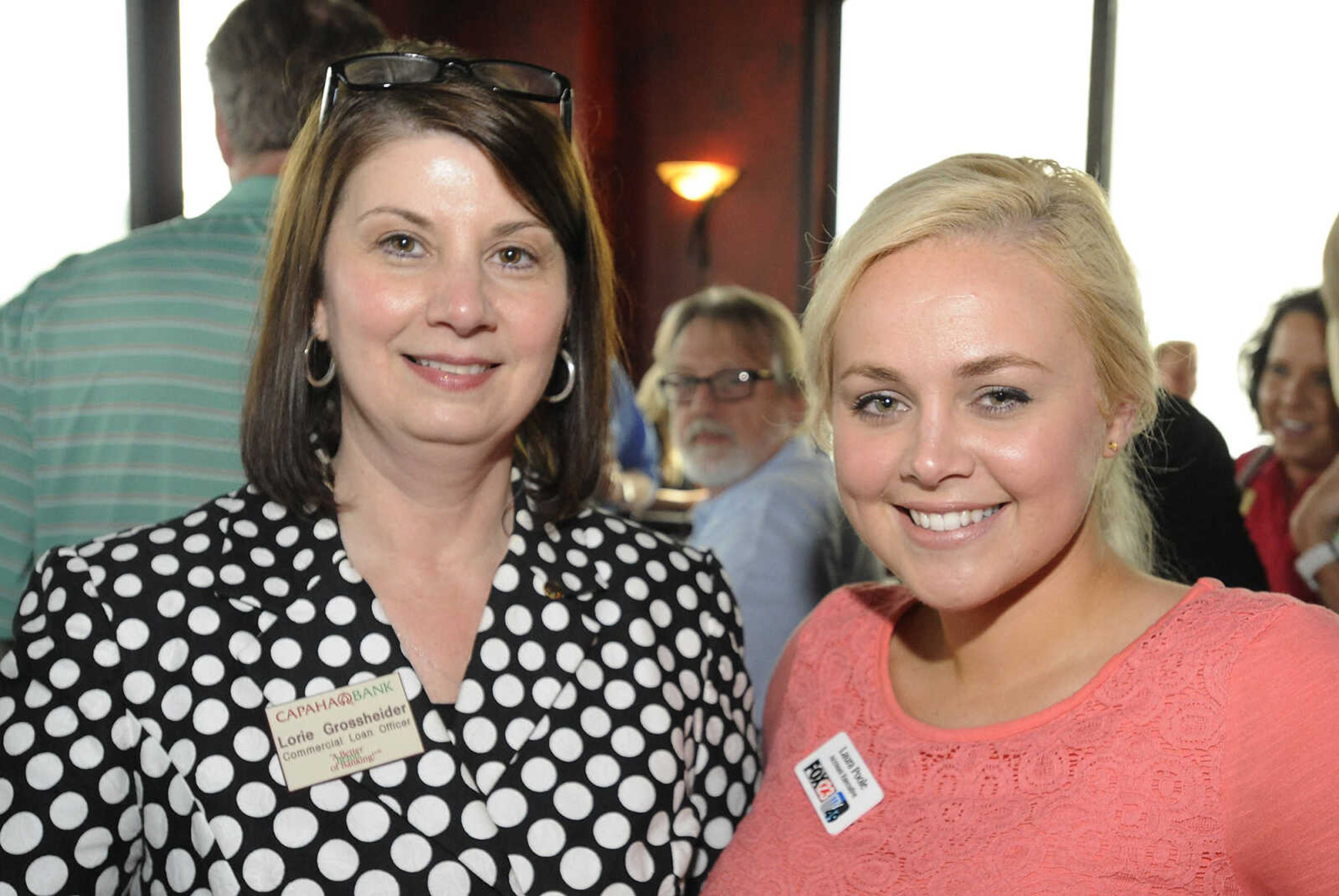 Lorie Grossheider, of Capaha Bank, left, and Laura Poole, of Fox 23, during the Cape Girardeau Area Chamber of Commerce Business After Hours Tuesday, June 18, at The Library, 10 South Spanish St., in Cape Girardeau.