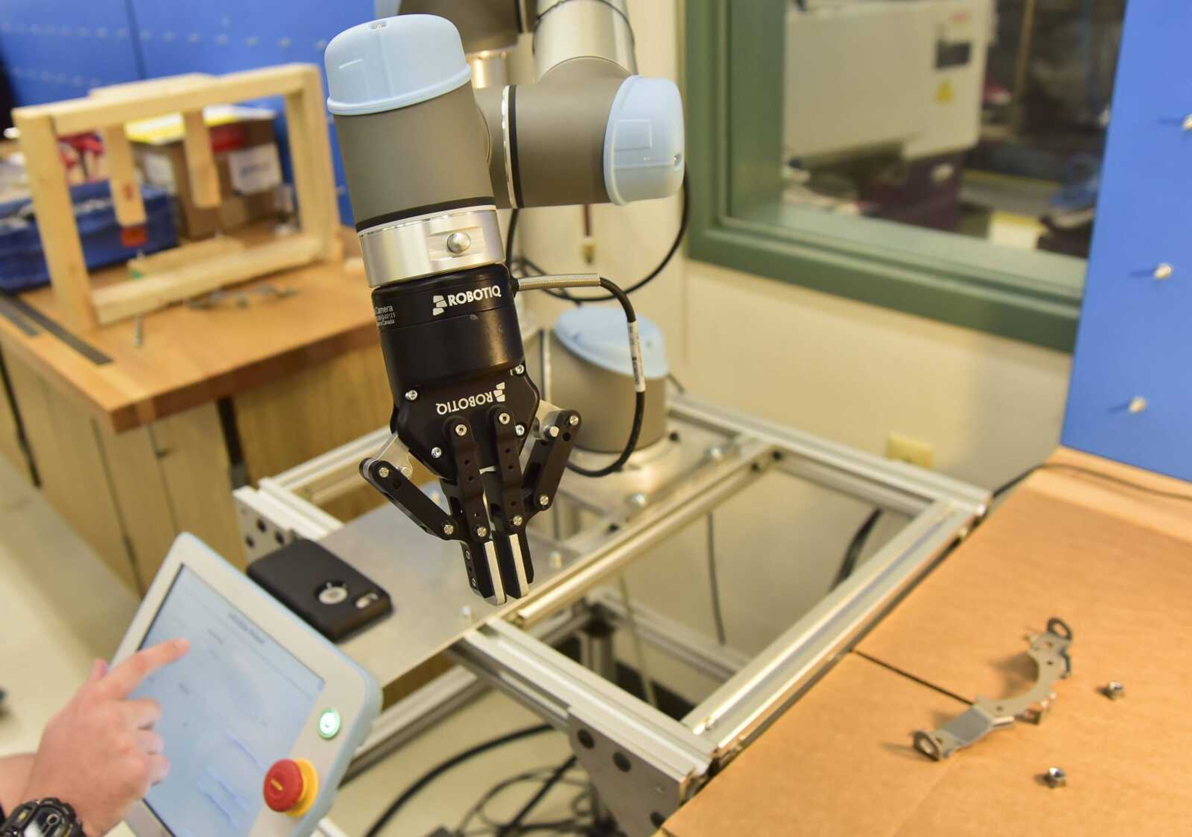 Student Billy Dasher uses a robotic arm Thursday at Southeast Missouri State University in Cape Girardeau.