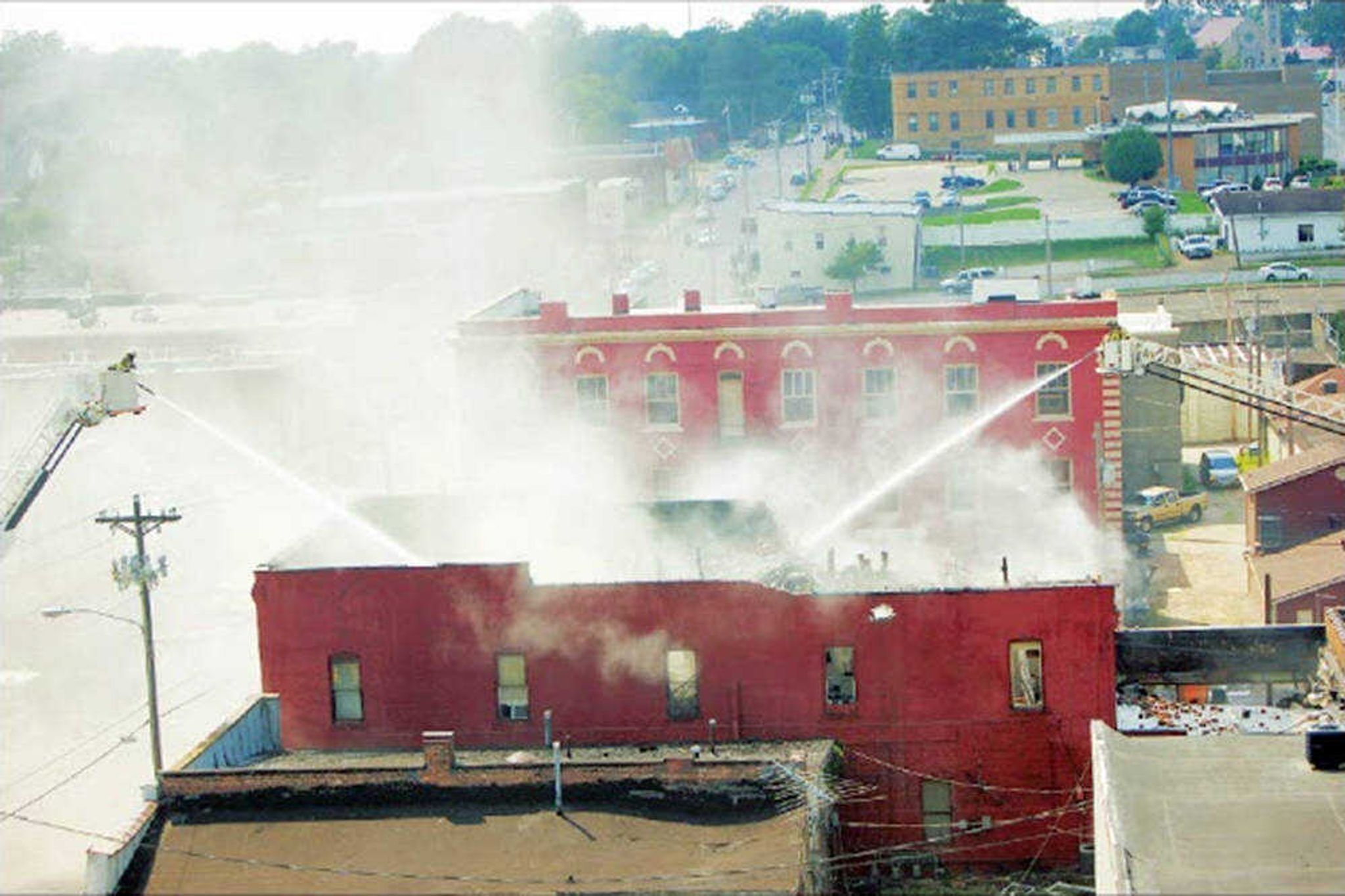 Firefighters battle a blaze Wednesday in downtown Poplar Bluff, Missouri.