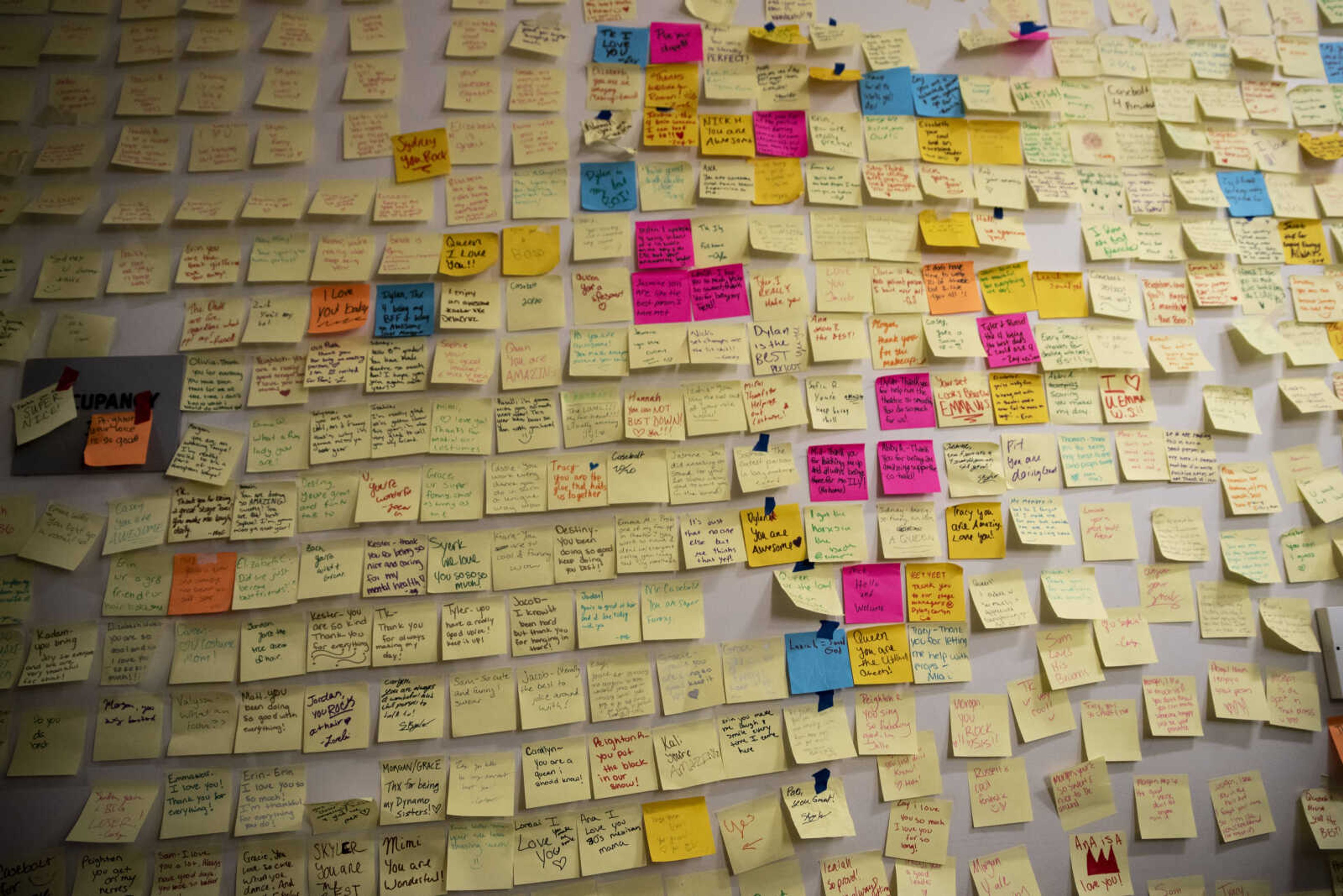 Post-it notes full of positive remarks and compliments hang on a wall backstage during the media night of Cape Central High School's spring musical production of "Mamma Mia!" Wednesday, April 10, 2019, in Cape Girardeau. "We write compliments to help keep everyone encouraged," said Morgan Green, 17, portraying the role of Tanya Chesam-Leigh.