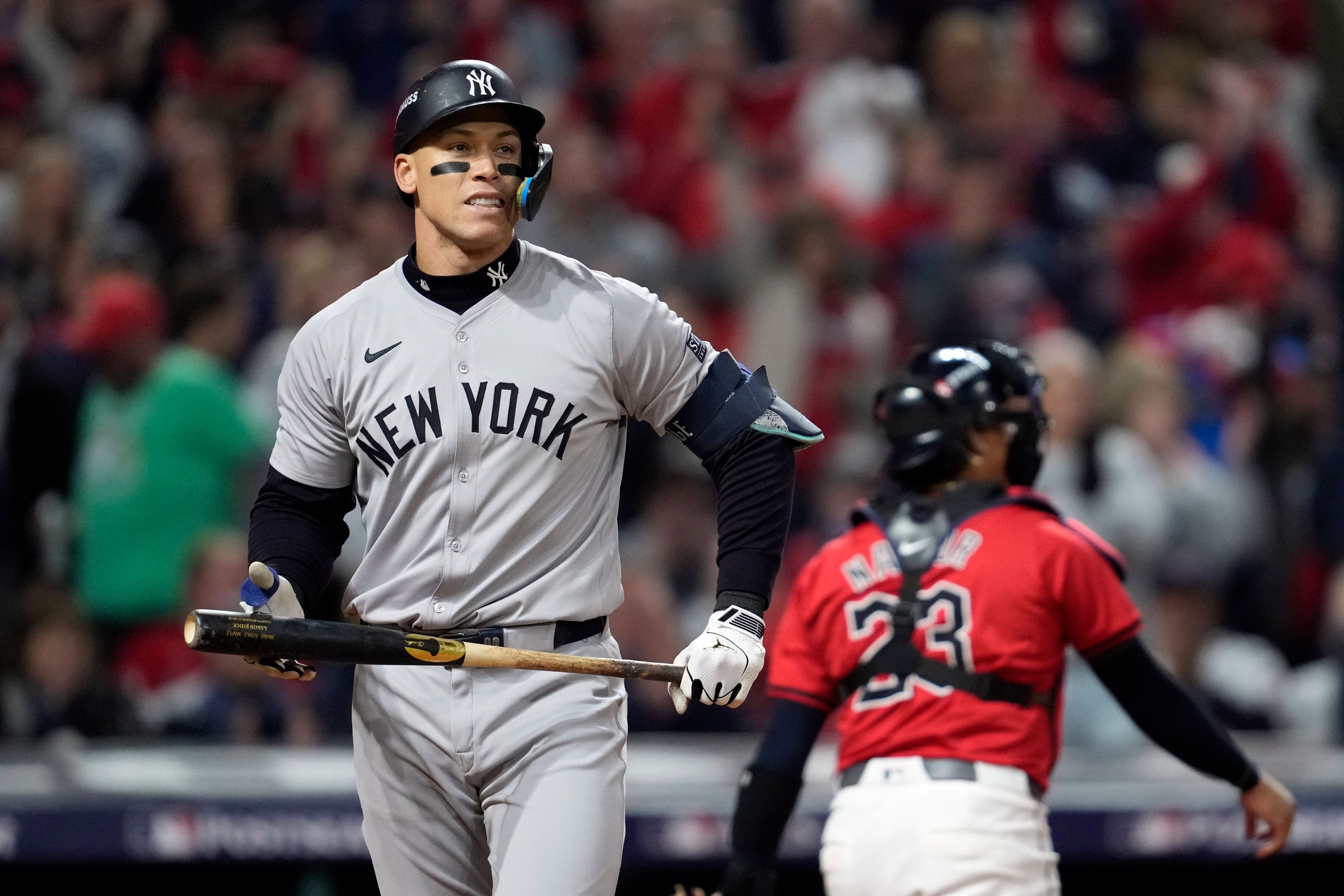 New York Yankees' Aaron Judge walks back toward the dugout after striking out against the Cleveland Guardians during the third inning in Game 5 of the baseball AL Championship Series Saturday, Oct. 19, 2024, in Cleveland. (AP Photo/Godofredo A. Vásquez)