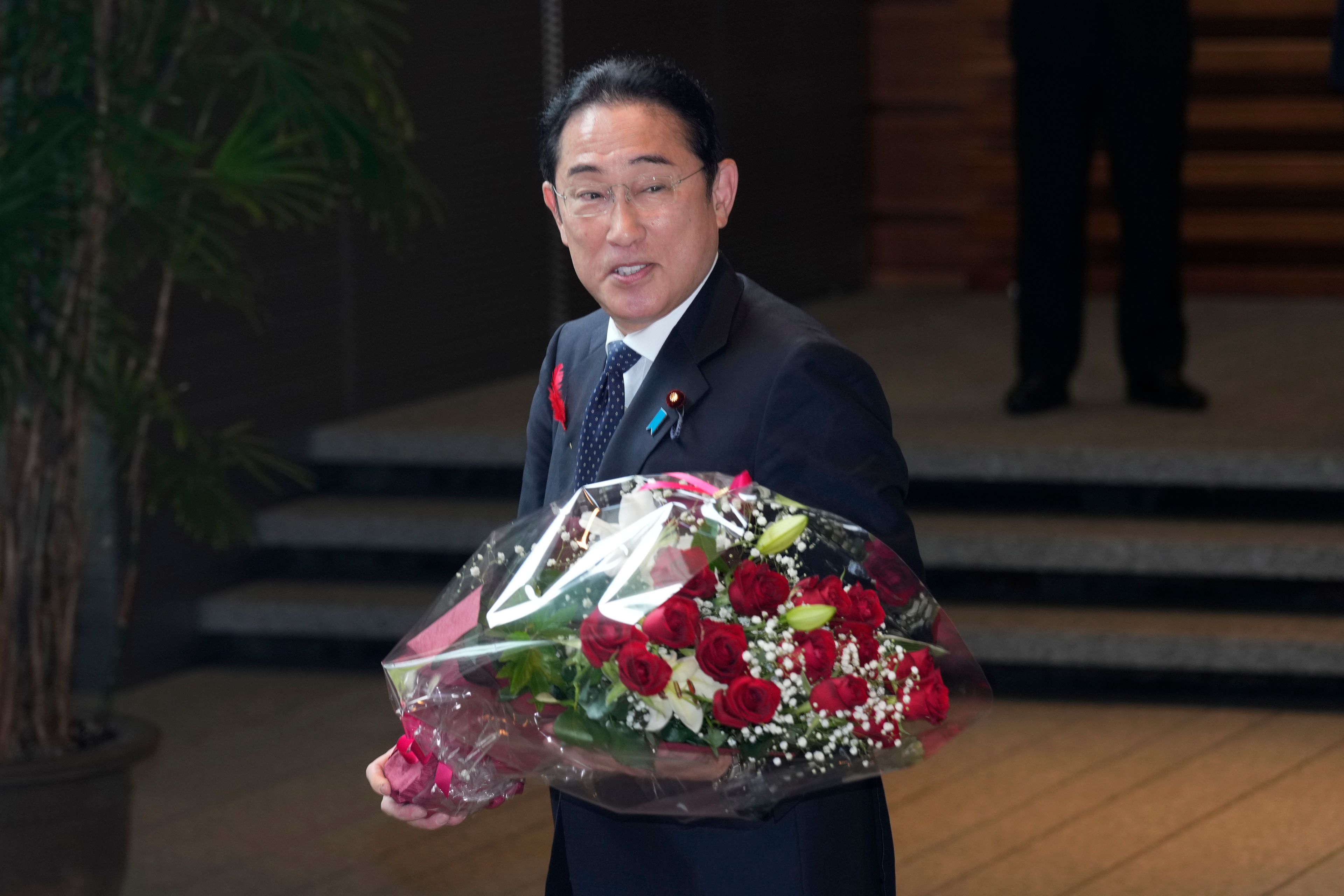 Japan's outgoing Prime Minister Fumio Kishida stops as media members asked him to make a comment before he leaves the prime minister's office in Tokyo Tuesday, Oct. 1, 2024. (AP Photo/Hiro Komae)