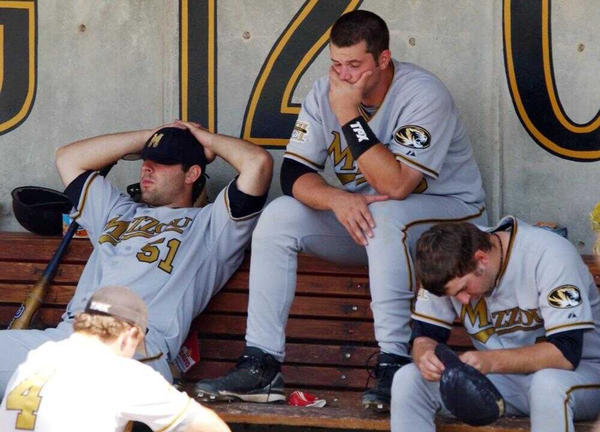 Missouri's Jacob Priday, left, John McKee, center, and Brant Combs sat on the bench after Monday's 16-6 loss to Louisville in the NCAA Columbia Regional final in Columbia, Mo. (L.G. PATTERSON ~ Associated Press)