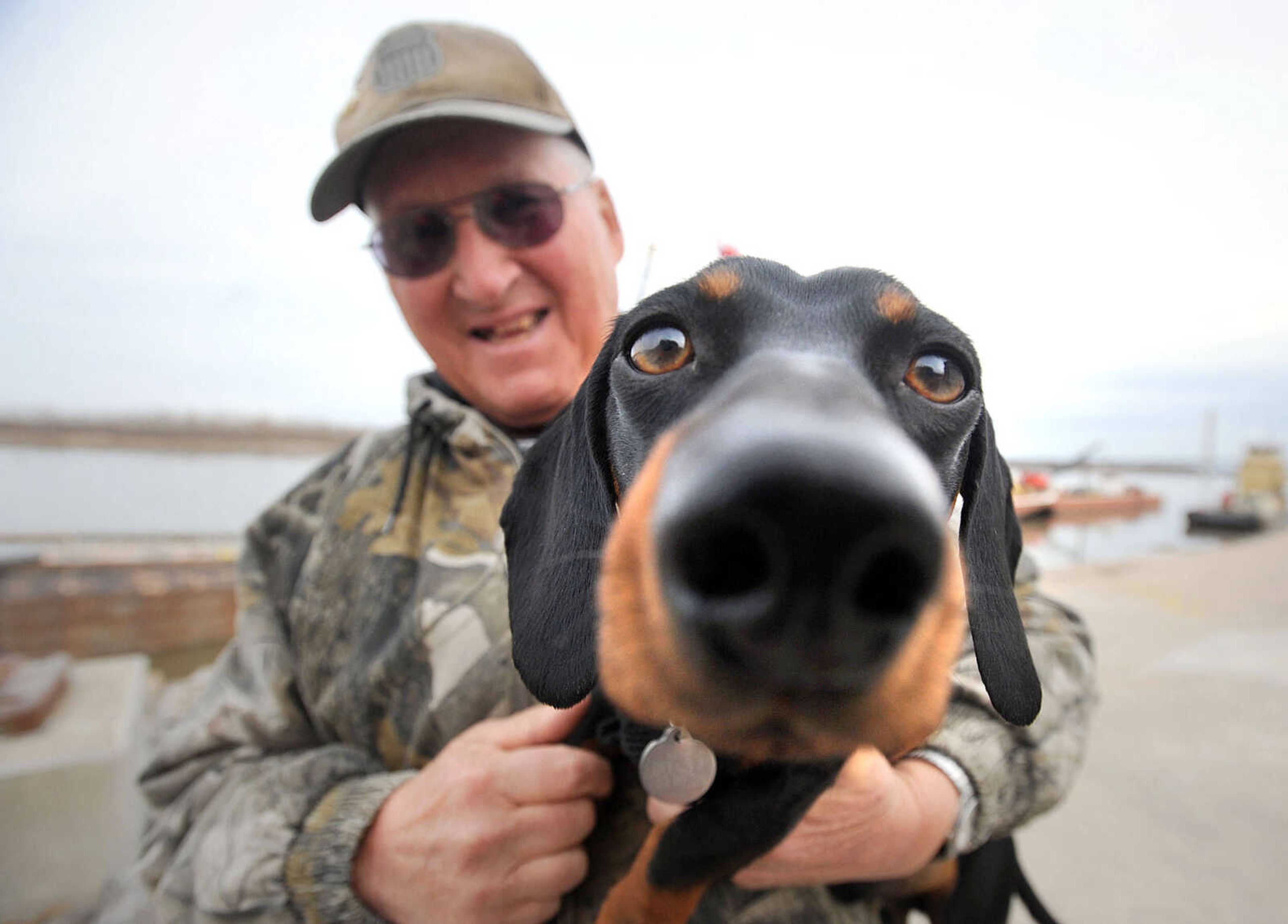 David Hente and Fritz hang out along the Mississippi River riverwalk in downtown Cape Girardeau. (Laura Simon)