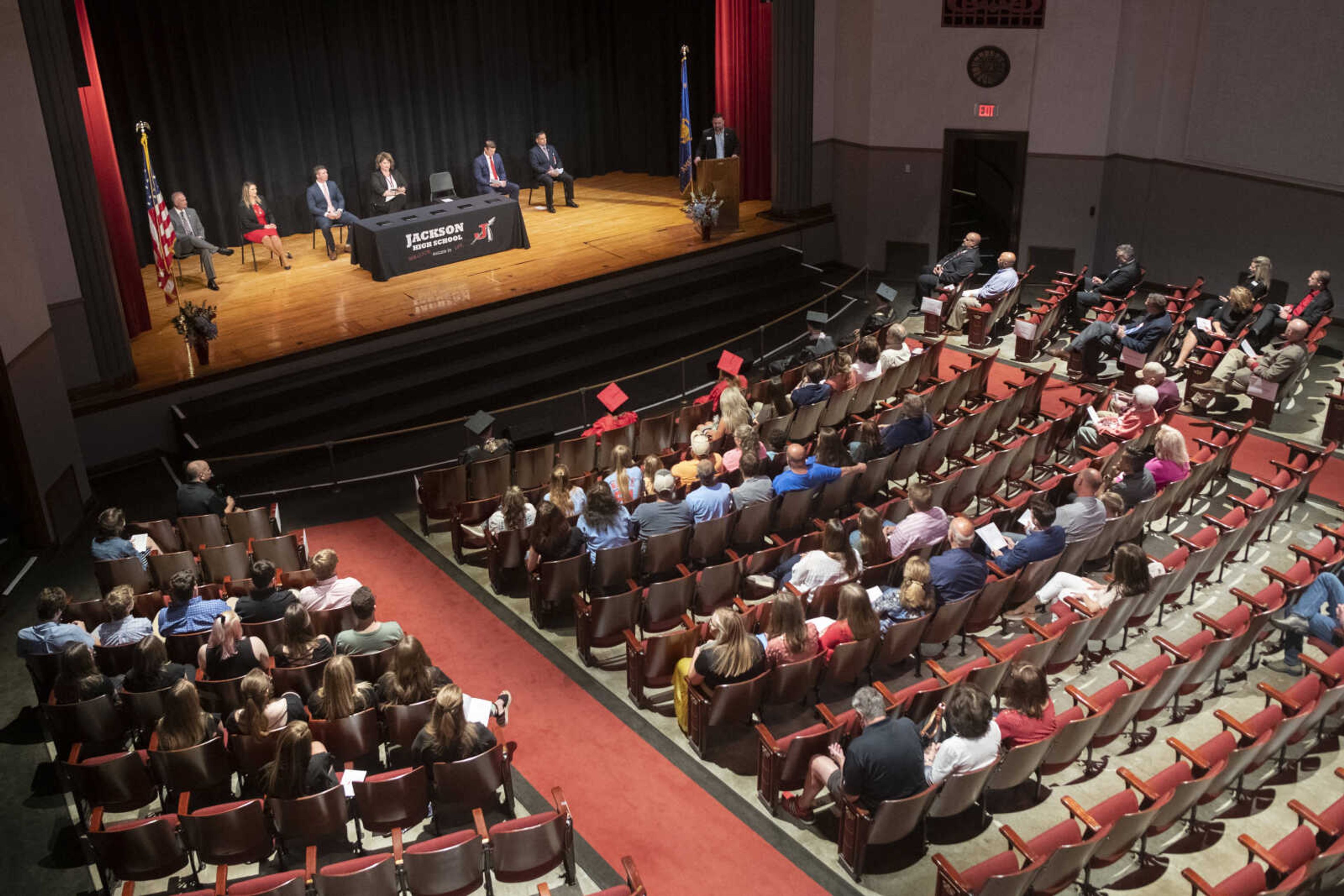 People gather in an auditorium for an in-person military graduation ceremony Friday, May 22, 2020, at Jackson High School.