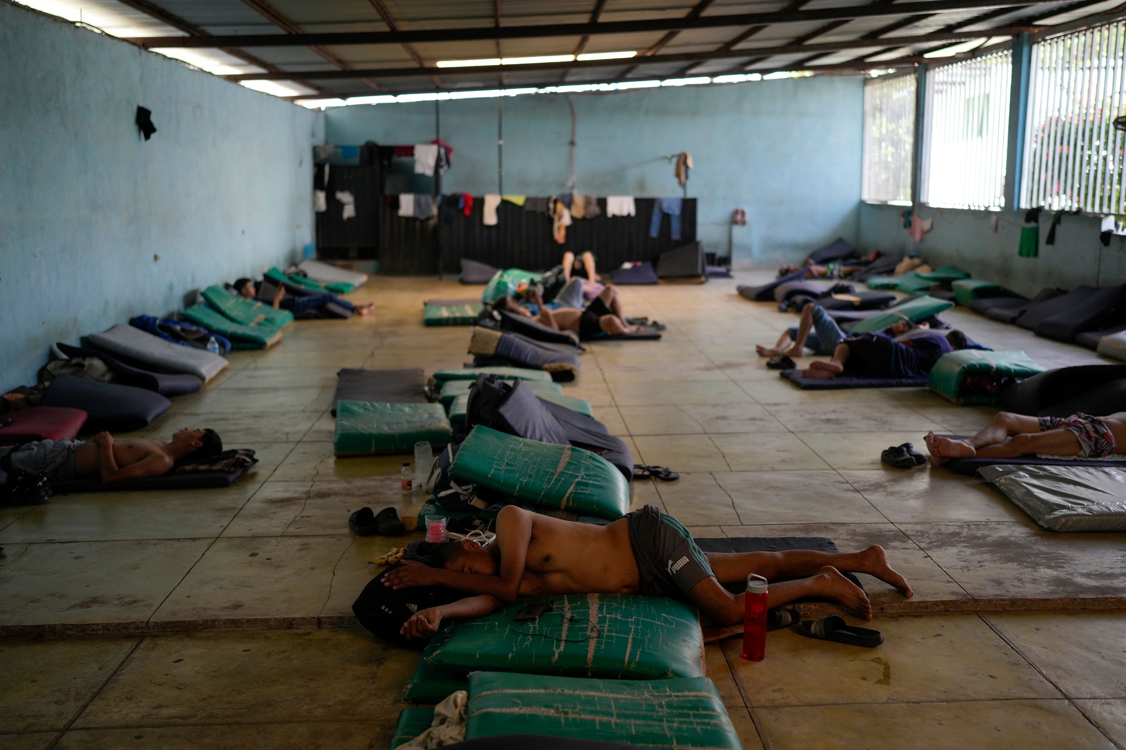 Honduran migrant Elvin Cruz rests on a mat in a shelter in Tapachula, Mexico, Monday, Oct. 28, 2024. (AP Photo/Matias Delacroix)