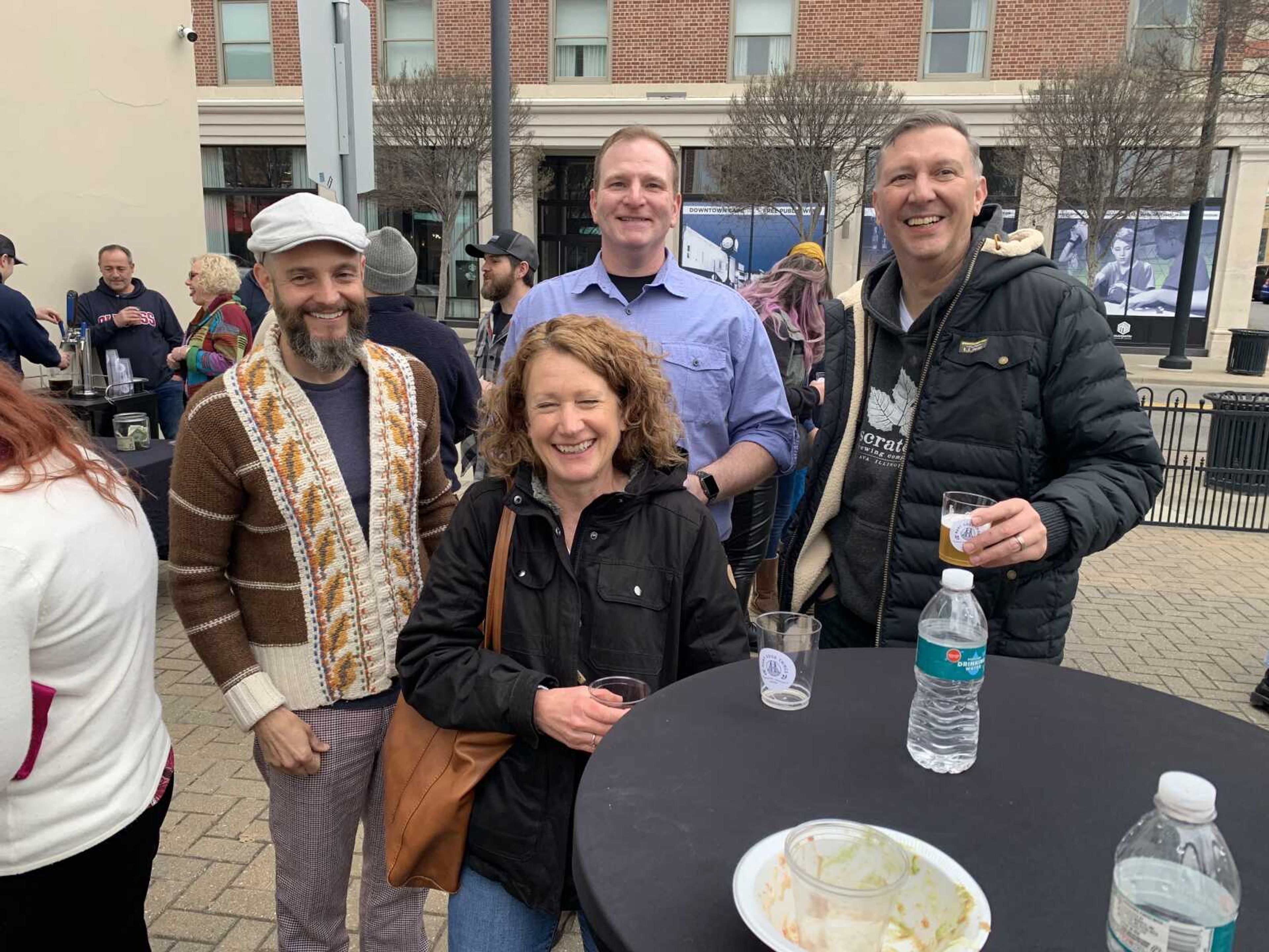 Juror Daniel Perry, back, and Christopher Rieger, director of the Center for Faulkner studies at Southeast Missouri State University, right, talk with other patrons of Thursday's opening reception of the 2022 Outdoor Sculpture Exhibition in Cape Girardeau.