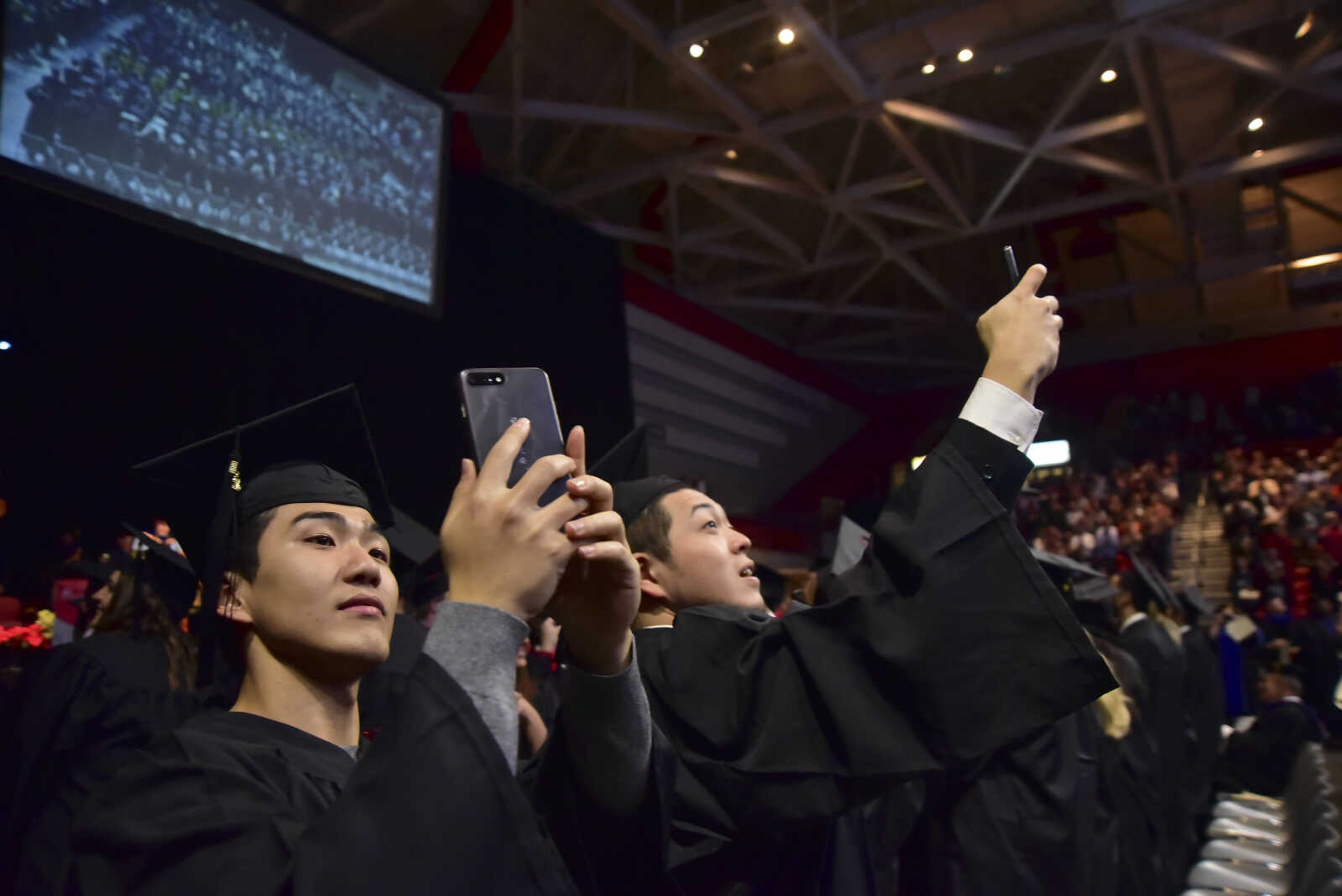 ANDREW J. WHITAKER ~ awhitaker@semissourian.com
Students use their phones to take photos and video after Southeast Missouri State University graduation Saturday, Dec. 17, 2016 at the Show Me Center in Cape Girardeau.