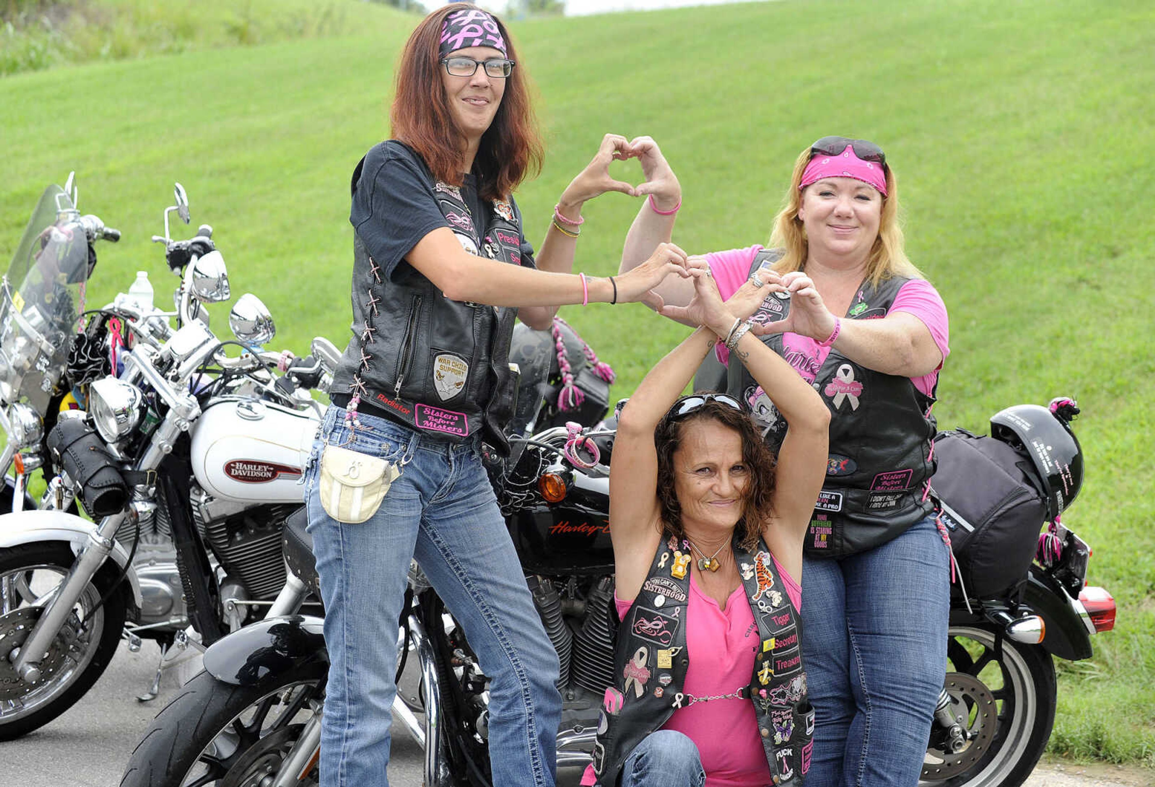 LAURA SIMON ~ lsimon@semissourian.com

Members of the Chrome Queens, Angela "Smalls" Peters, left, Char "Tigger" Miller, center, and Susie "Sizzle" Smith pose for a photo on Thursday, Aug. 18, 2016, in Cape Girardeau.