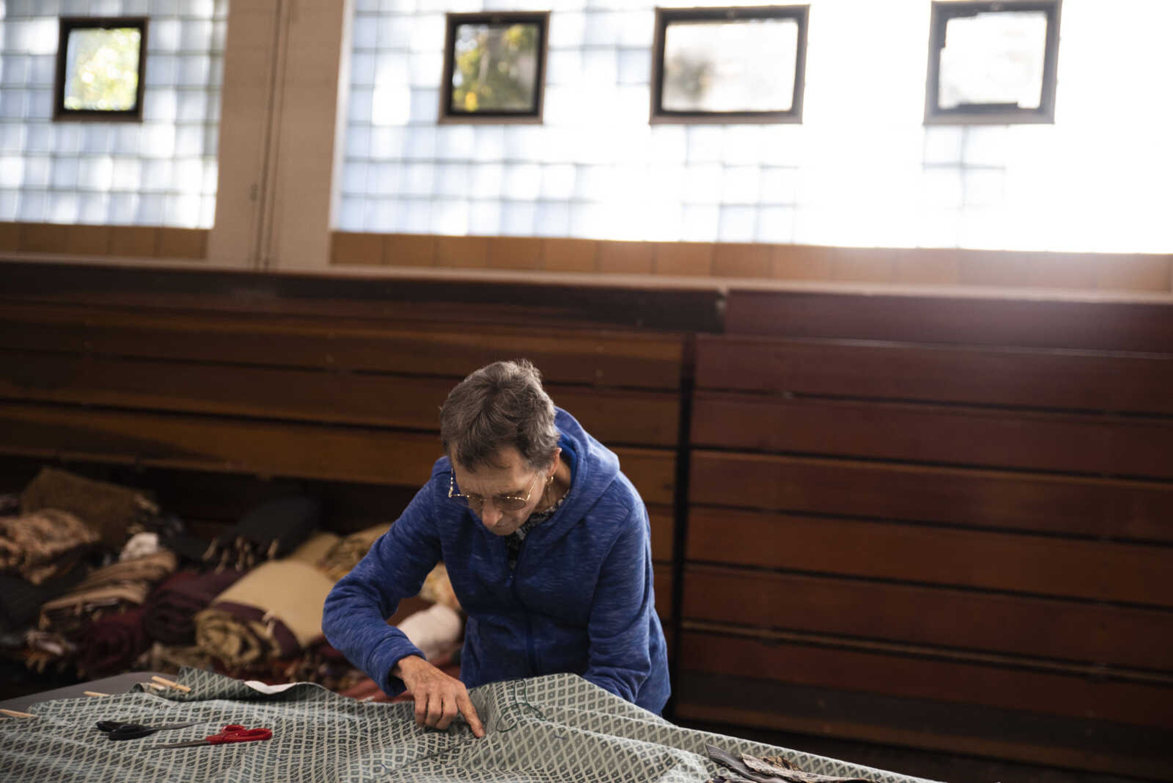 Judy Roth tacks a quilt during the Ugly Quilt Weekend at St. Vincent de Paul Parish Sunday, Oct. 28, 2018, in Cape Girardeau.