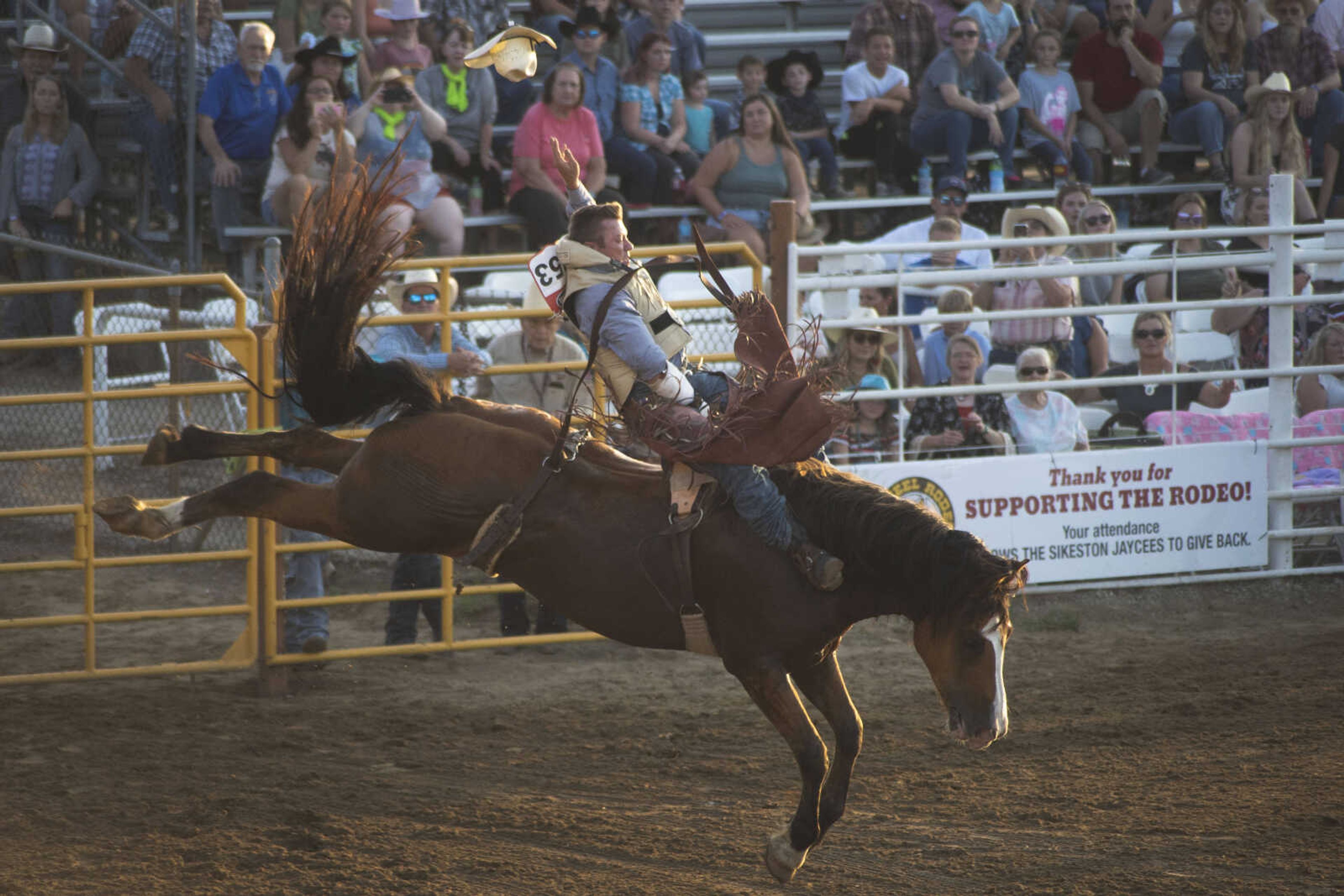 A rider performs during the first night of the Sikeston Jaycee Bootheel Rodeo on Wednesday, Aug. 11, 2021, in Sikeston, Missouri.