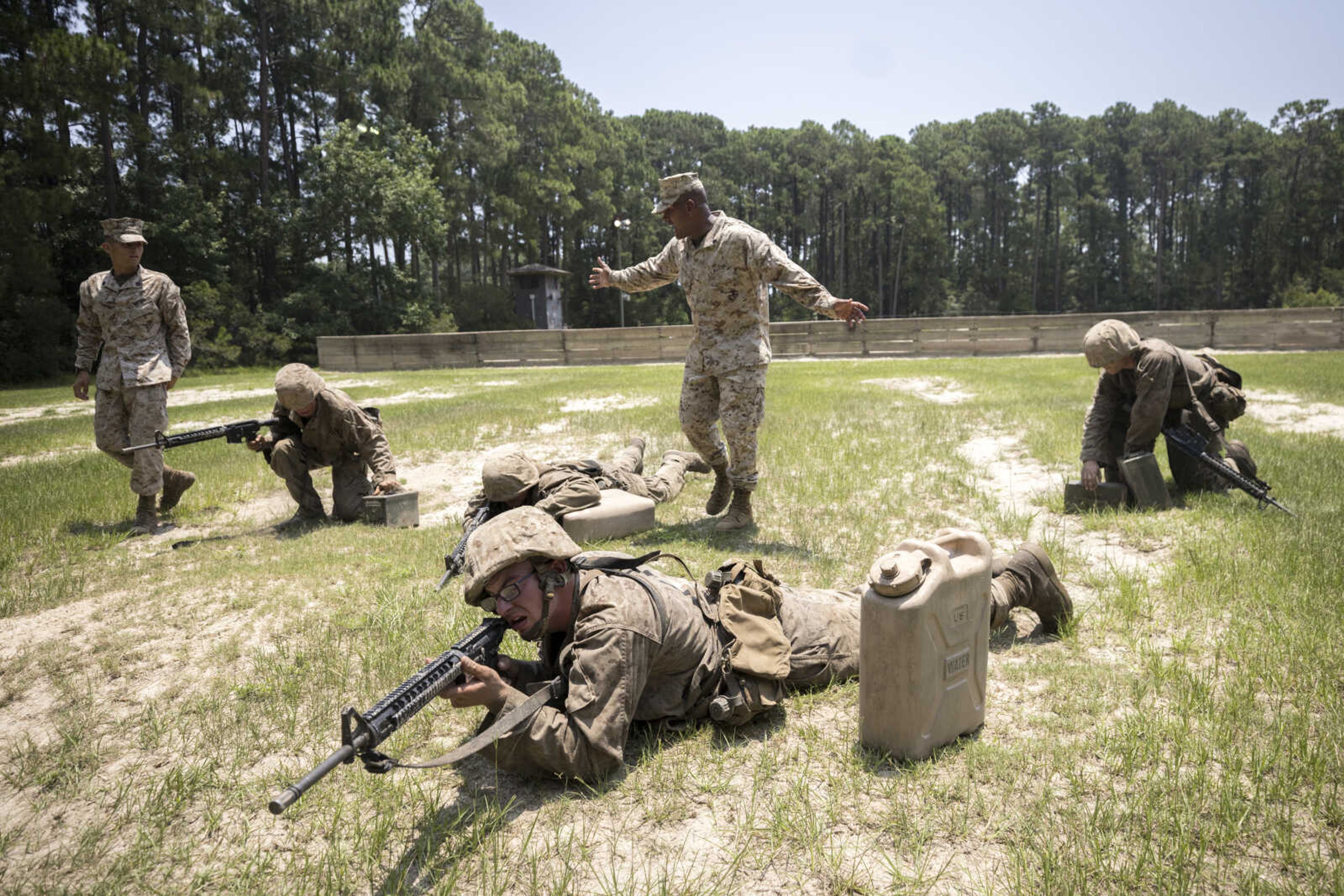 Drill instructor Sgt. Ramon Bruno, center, trains recruits during a portion of training known as the Crucible at the Marine Corps Recruit Depot on June 29 in Parris Island, South Carolina.