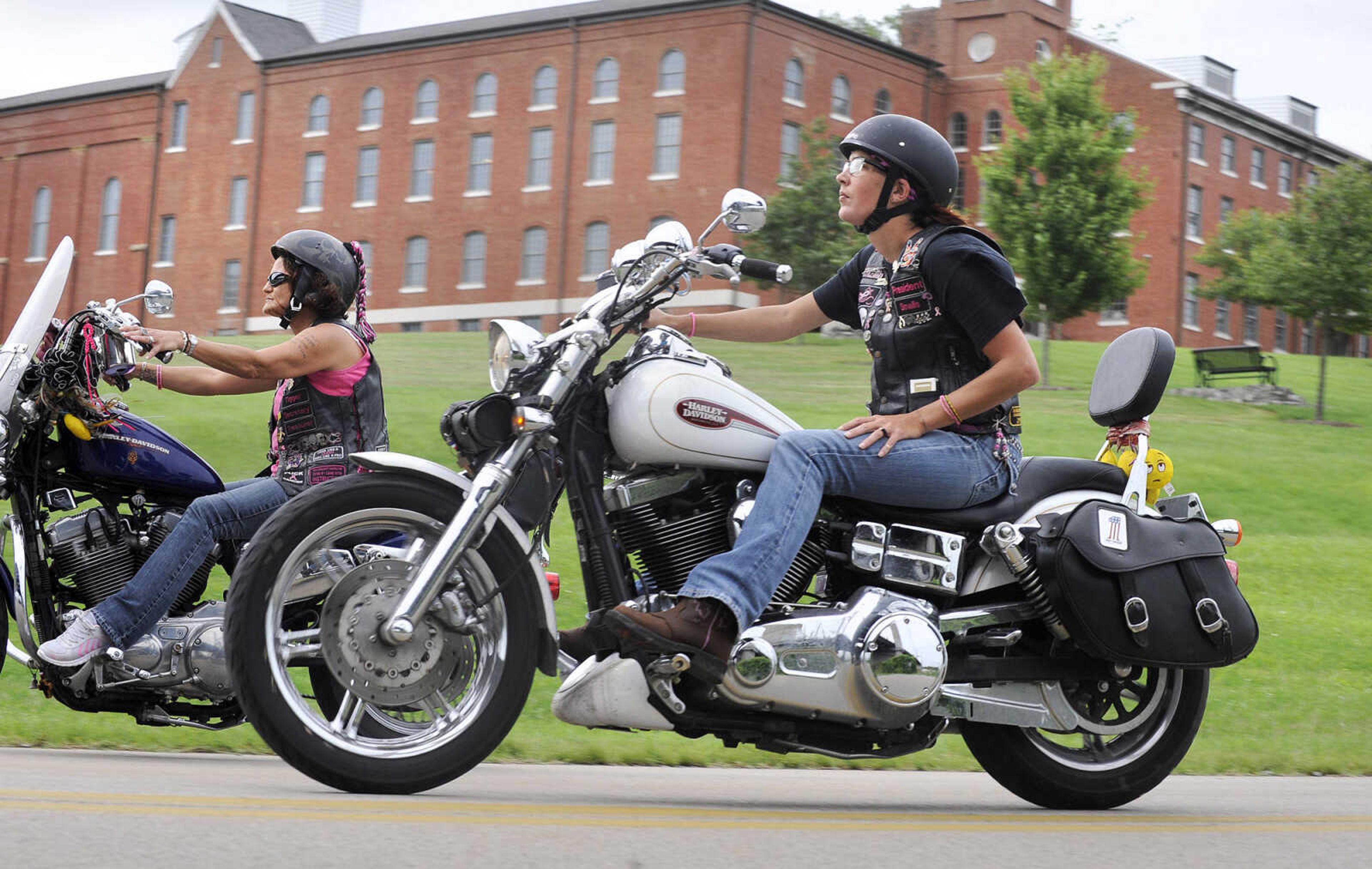 LAURA SIMON ~ lsimon@semissourian.com

Members of the Chrome Queens, Char "Tigger" Miller, left, and Angela "Smalls" Peters, cruise down Aquamsi Street in Cape Girardeau on Thursday, Aug. 18, 2016.