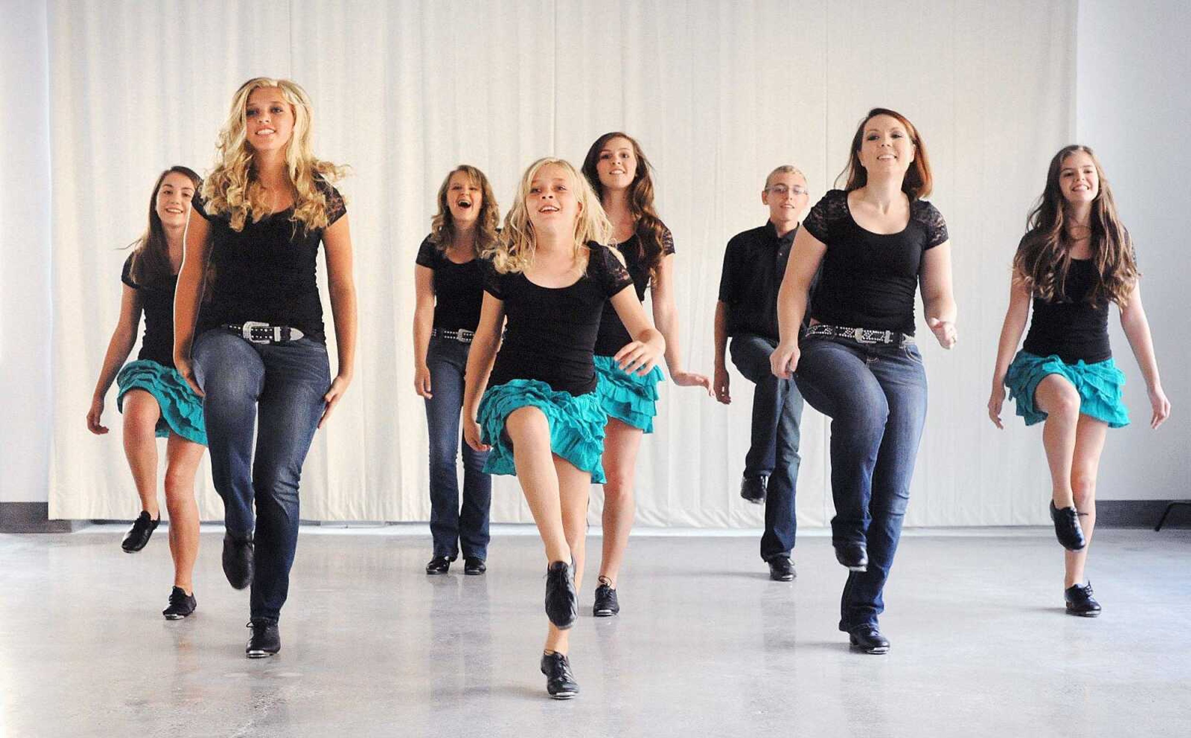 Jessica Price, second from right, and other dancers with  Country Fire cloggers demonstrate some of their steps Monday in Cape Girardeau. (Laura Simon)