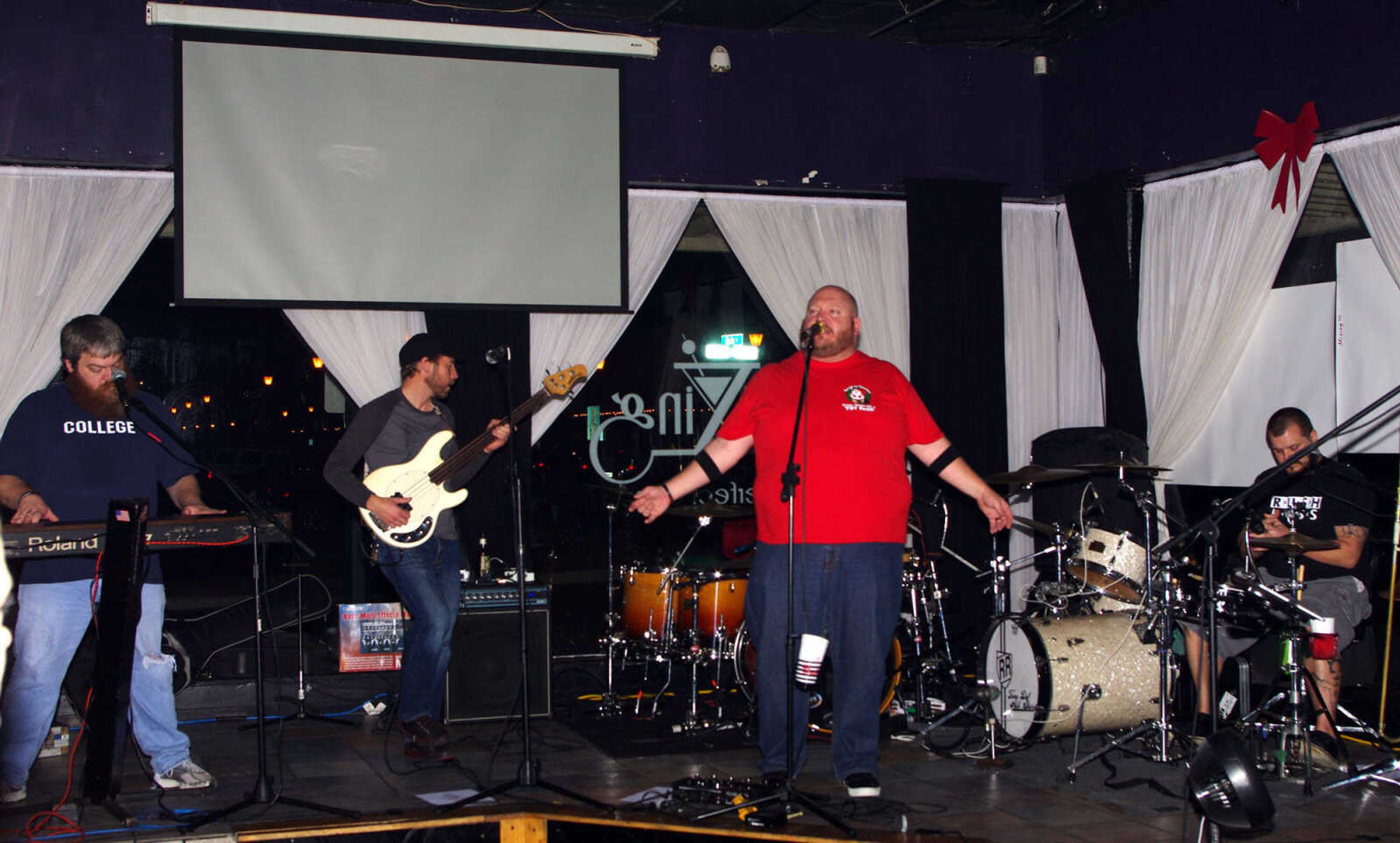 The Tone Def All-Stars put on a show during the 10th annual Happy Slapowitz's Toy Bash in downtown Cape Girardeau on Thursday Dec. 13, 2012.