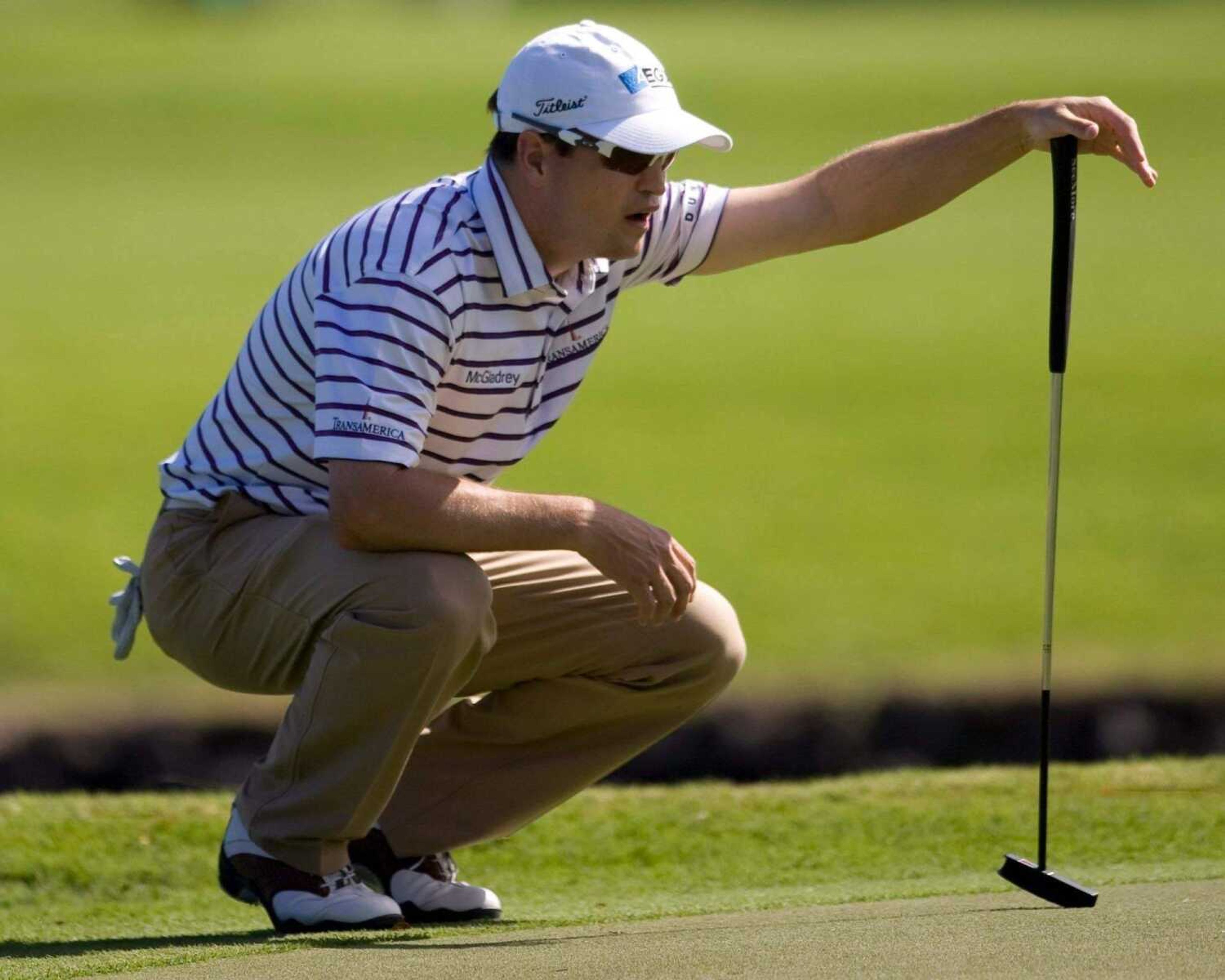 MARCO GARCIA ~ Associated Press<br>Zack Johnson lines up a putt on the third green during Sunday's final round of the Sony Open at the Waialae Country Club in Honolulu.