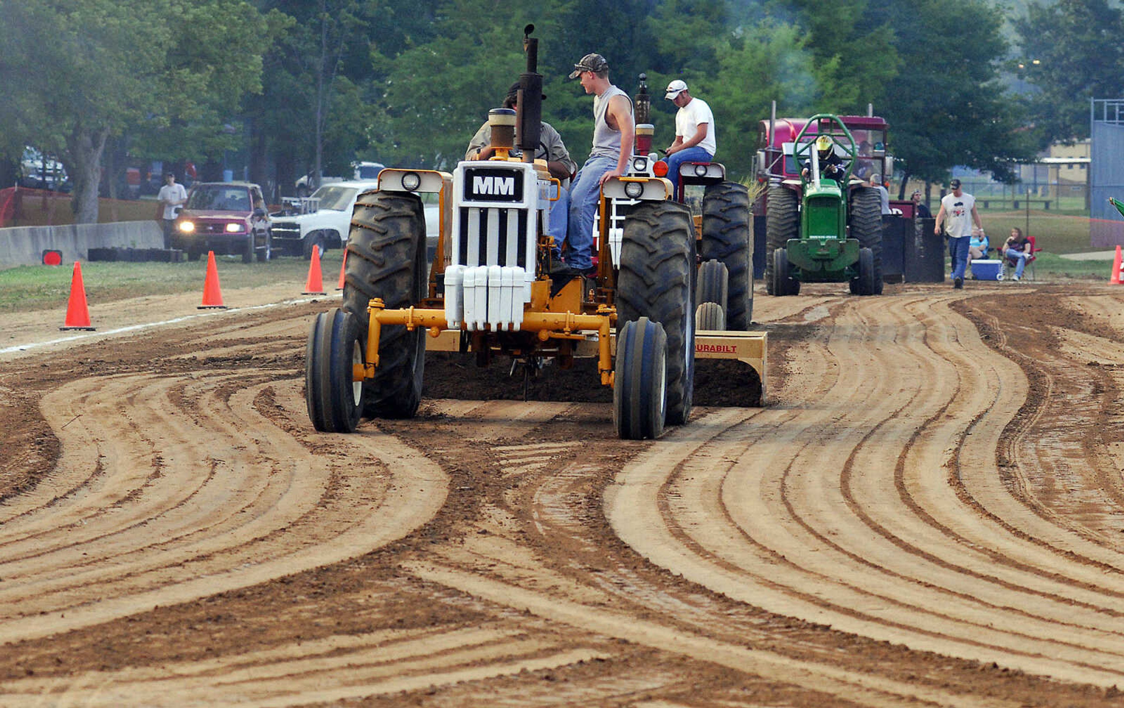 LAURA SIMON~lsimon@semissourian.com
Workers grate the pull stretch Saturday, May 29, 2010 during the "Pullin' for St. Jude" tractor and truck pull at Arena Park.