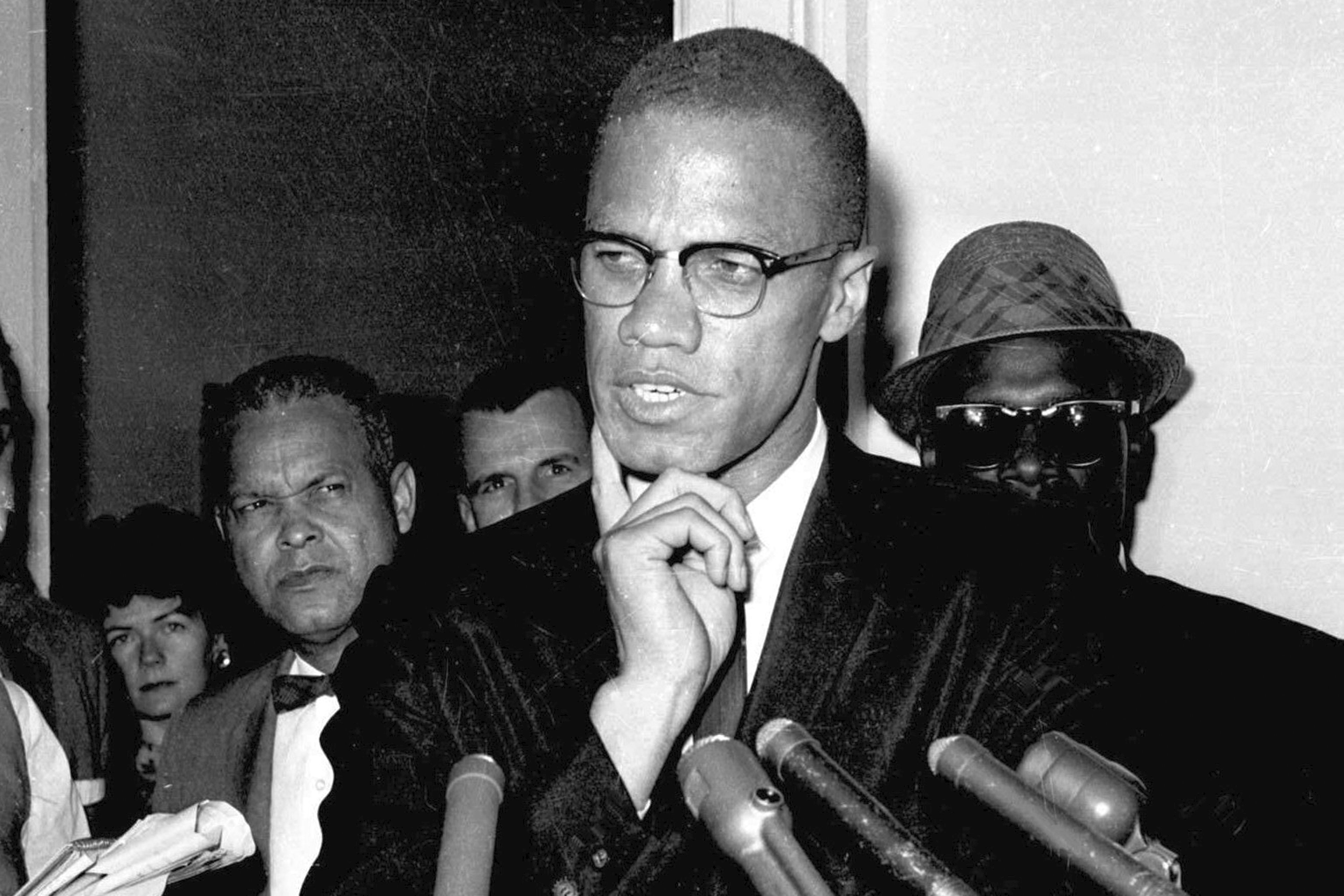 FILE - Malcolm X speaks to reporters in Washington, D.C., May 16, 1963. (AP Photo, File)