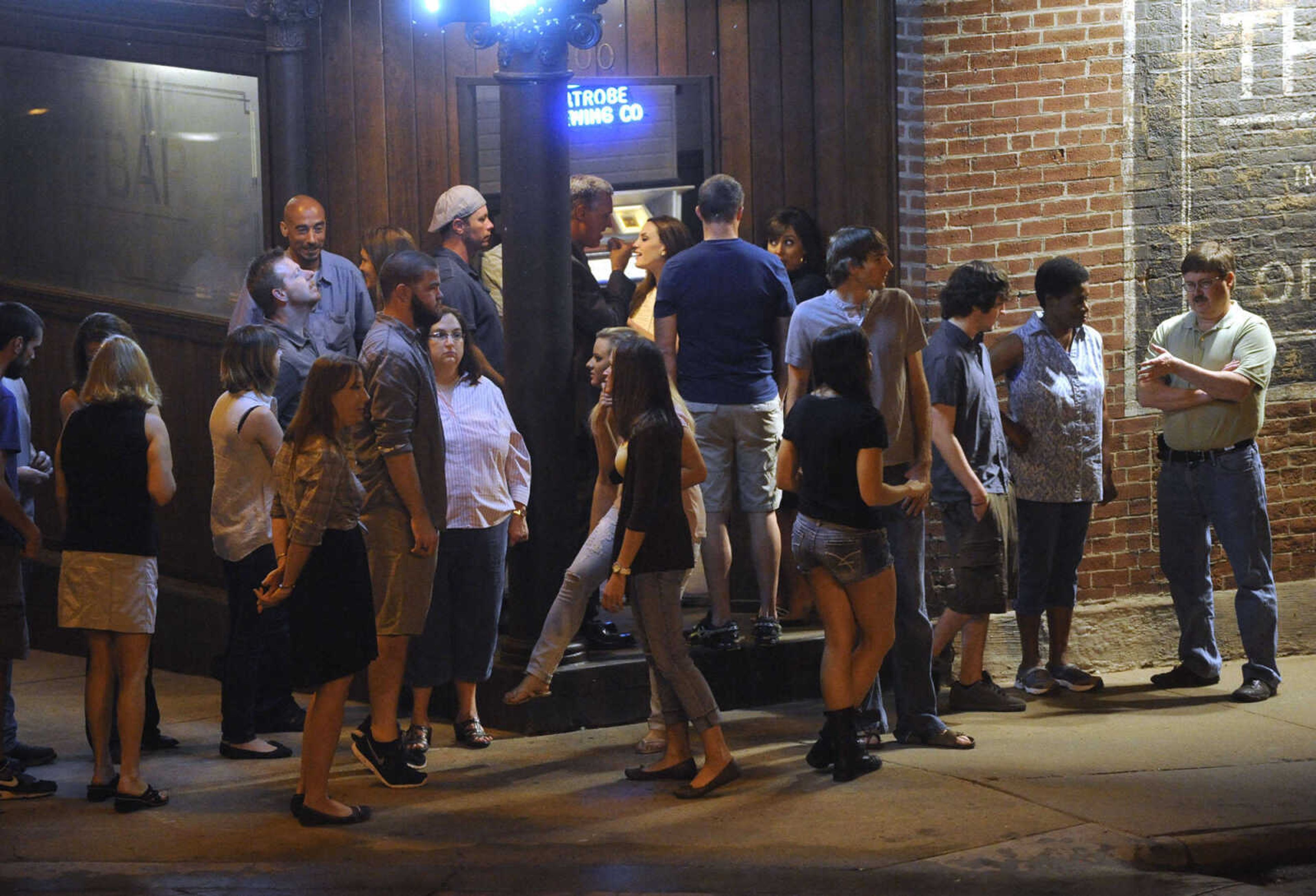 FRED LYNCH ~ flynch@semissourian.com
Extras for "Gone Girl" wait for rehearsal outside The Bar Friday, Sept. 27, 2013 in downtown Cape Girardeau.