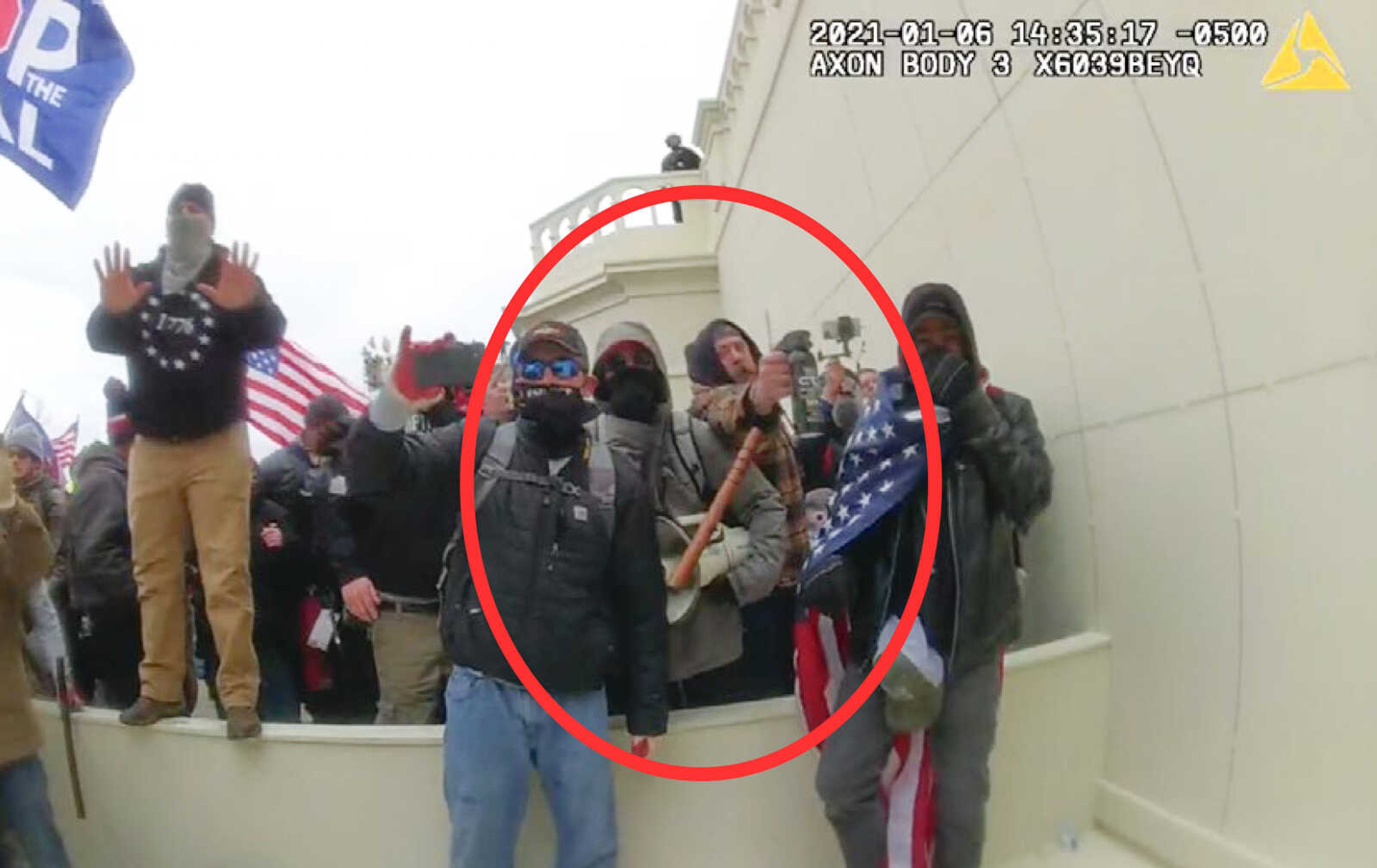 In this image from a Washington Metropolitan Police Department officer's body-worn video camera, released and annotated by the Justice Department in the Government's Sentencing Memorandum, Peter Schwartz (circled in red) is shown using a canister of pepper spray against officers Jan. 6, 2021, in Washington. Prosecutors sought a more than $70,000 fine for Schwartz. U.S. District Judge Amit Mehta sentenced Schwartz to more than 14 years in prison this month but didn't impose a fine.