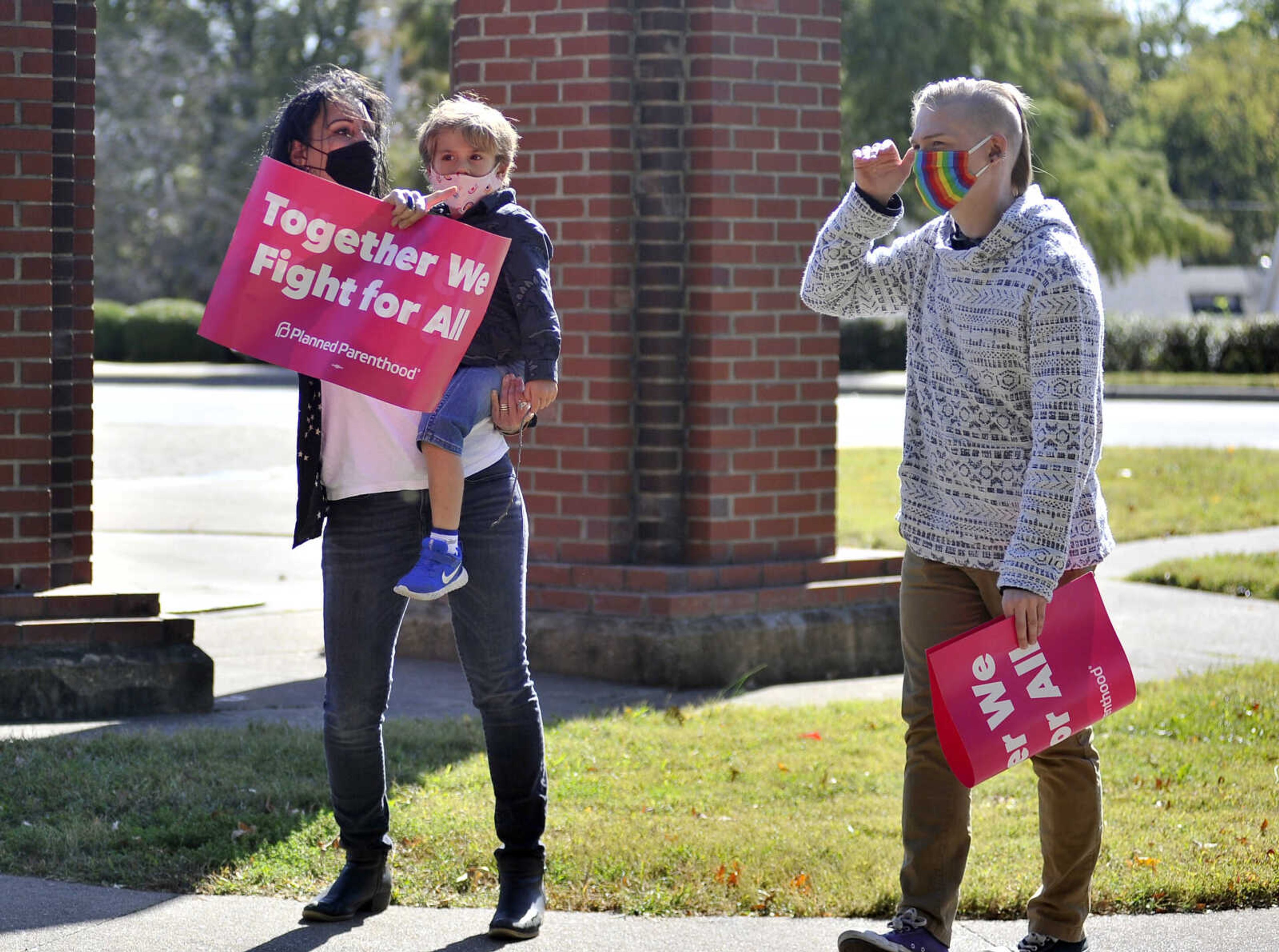 Brooke Holford ~ Southeast Missourian
Renee Harper, left, and her son, Jackson Marquez, 4, walk alongside Joey Choka at the SEMO Women's March on Saturday, Oct. 17, 2020, at Freedom Circle in Cape Girardeau.