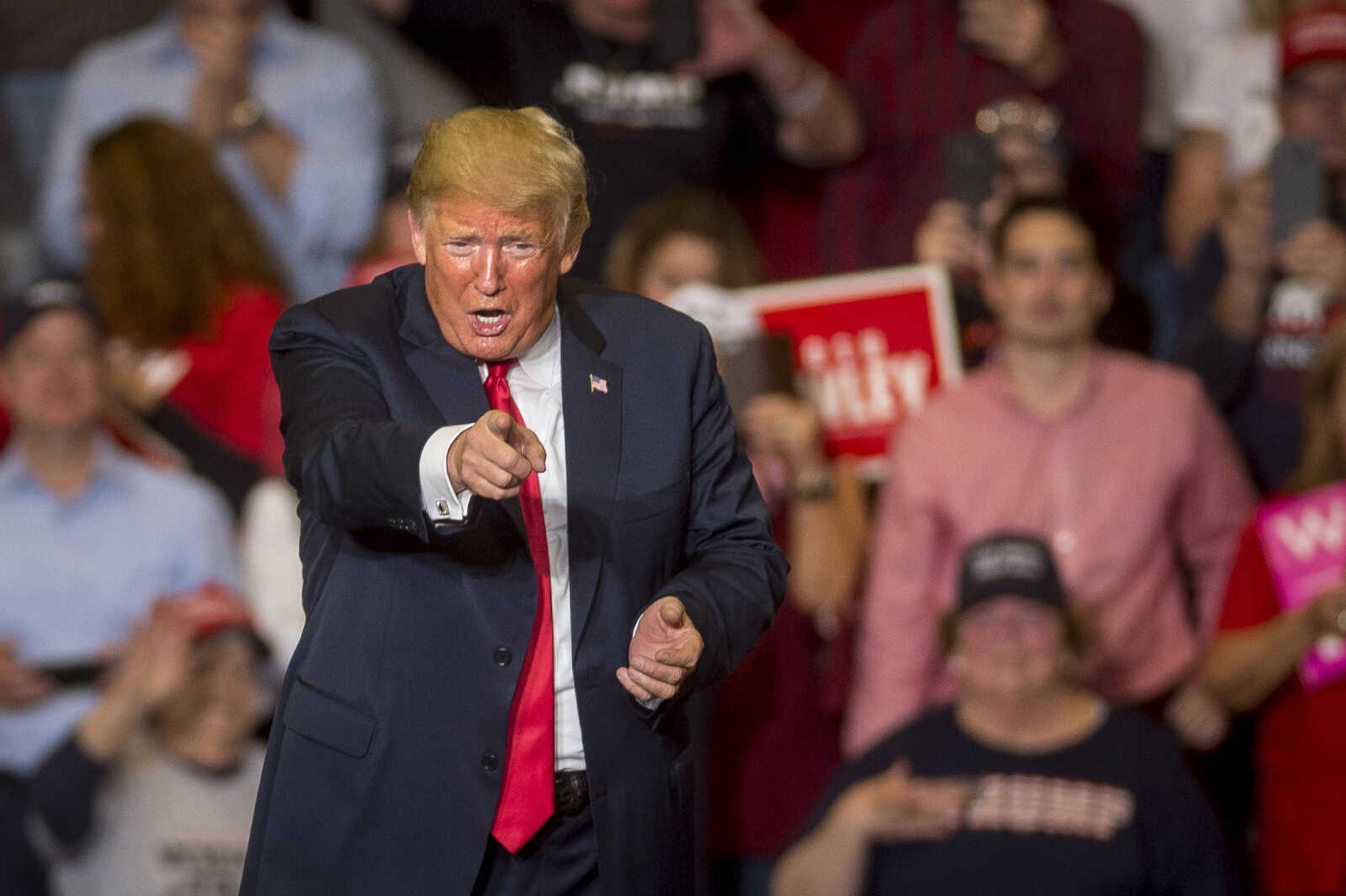 President Trump points to the crowd at the Show Me Center during a rally Monday.