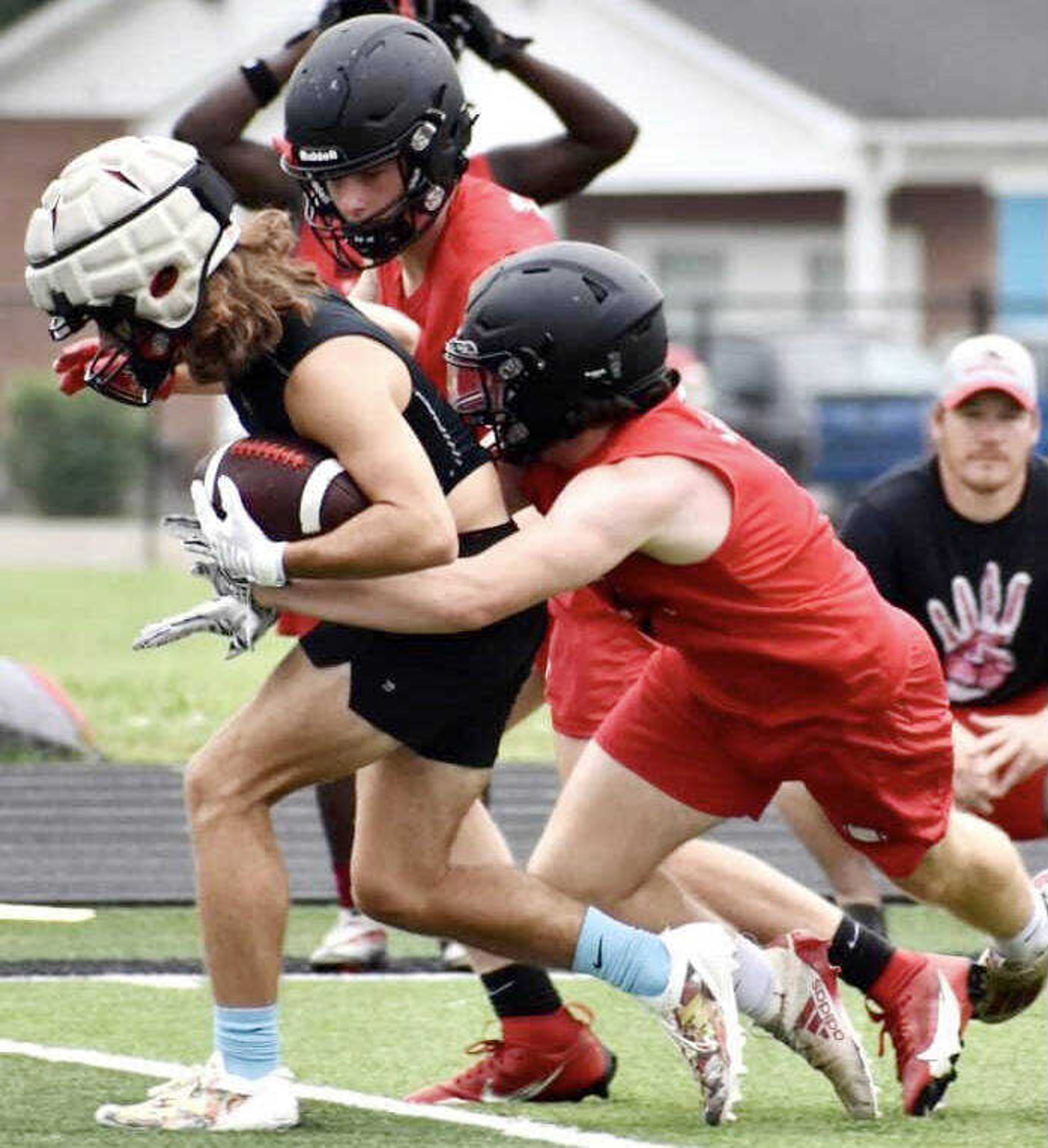 Sikeston sophomores Kenneth Holcomb and Mason King make a tackle at the Dexter 7-on-7 and Big Man Challenge on Wednesday, June 19, 2024. 