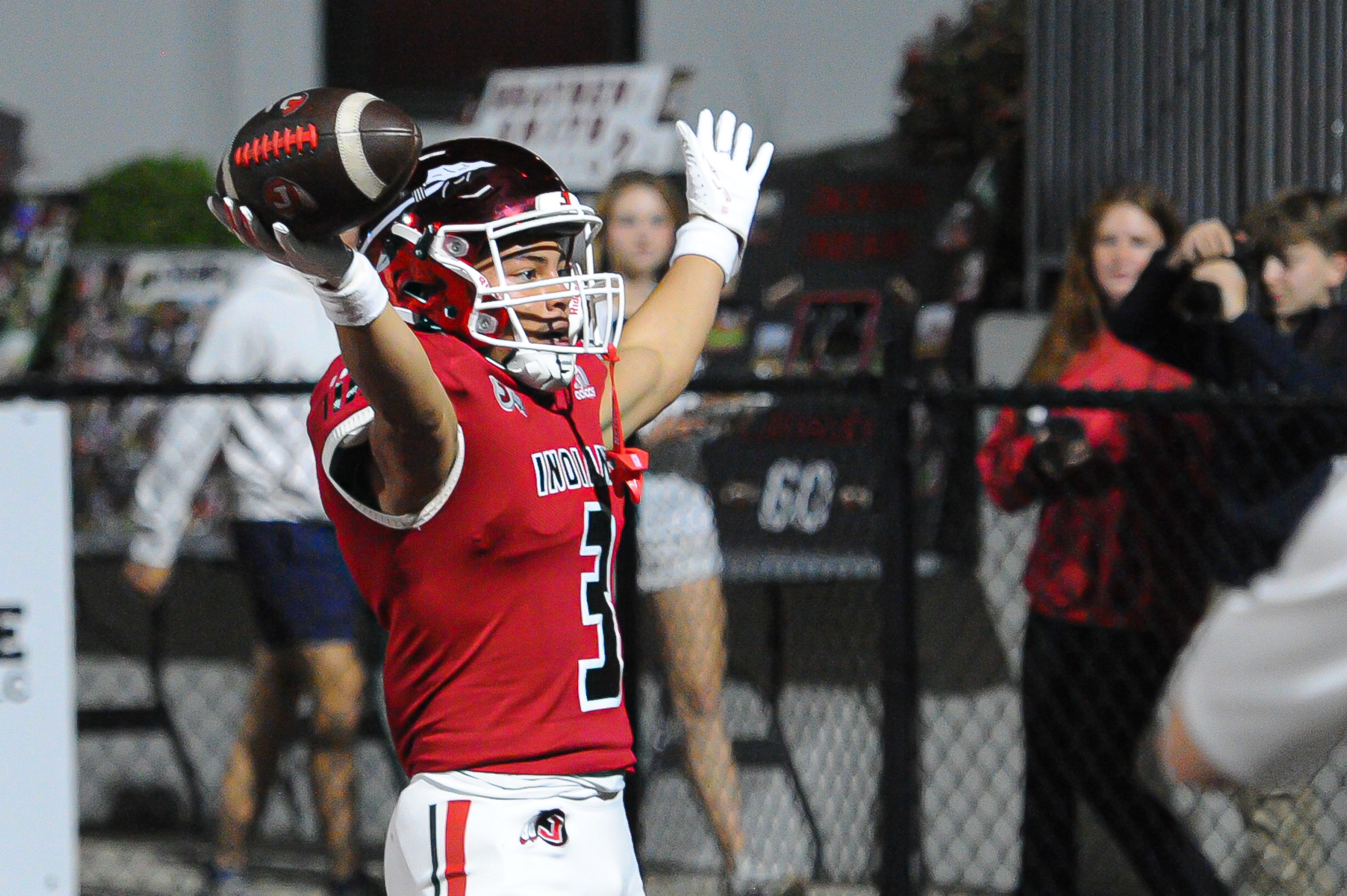 Jackson's Jaylon Hampton signals the touchdown to the student section during a Friday, October 25, 2024 game between the Jackson Indians and the Festus Tigers at "The Pit" in Jackson, Mo. Jackson defeated Festus, 43-7.