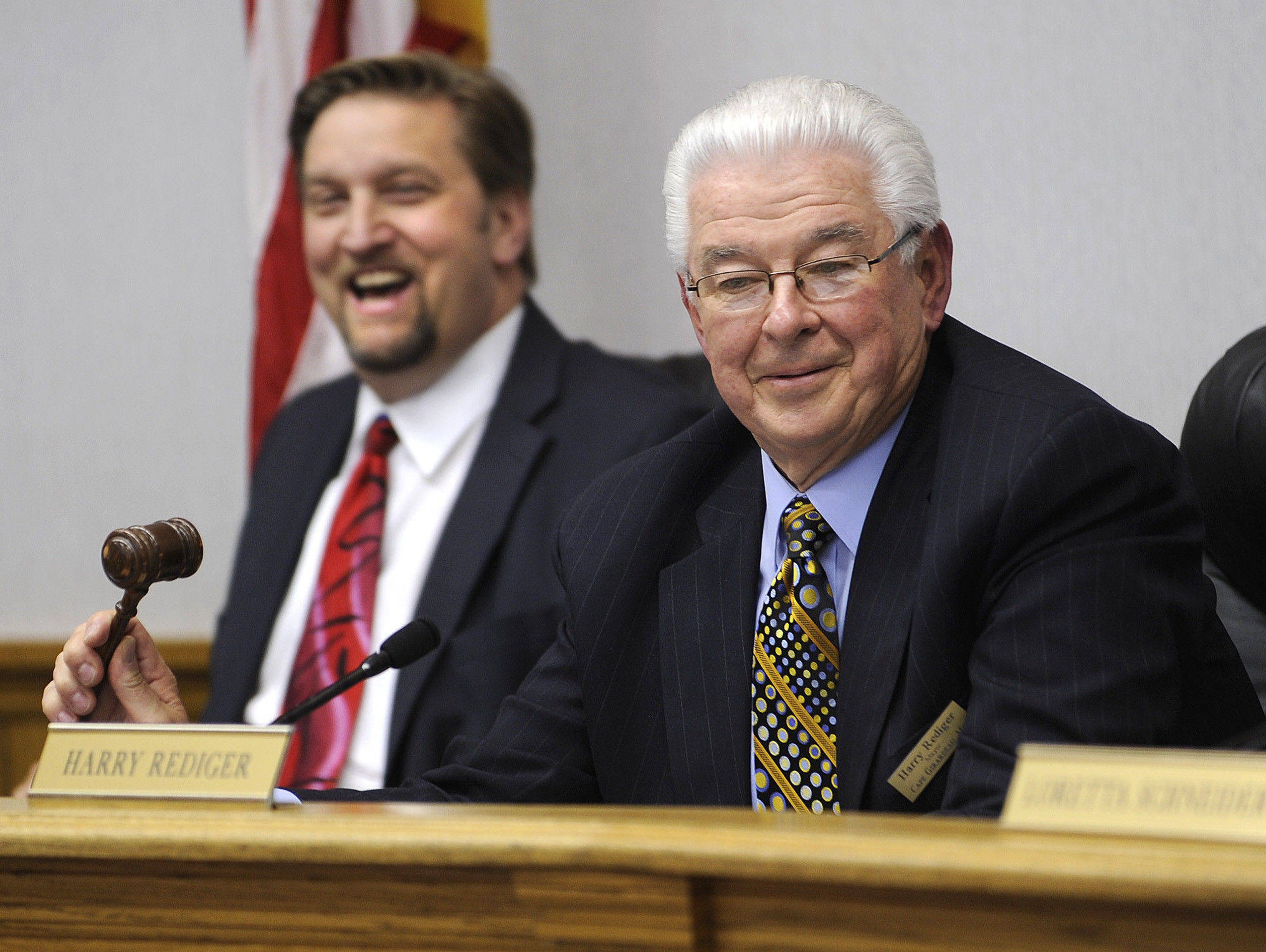 Mayor Harry Rediger does not use his gavel while closing his first City Council meeting April 9, 2010, as city manager Scott Meyer reacts.