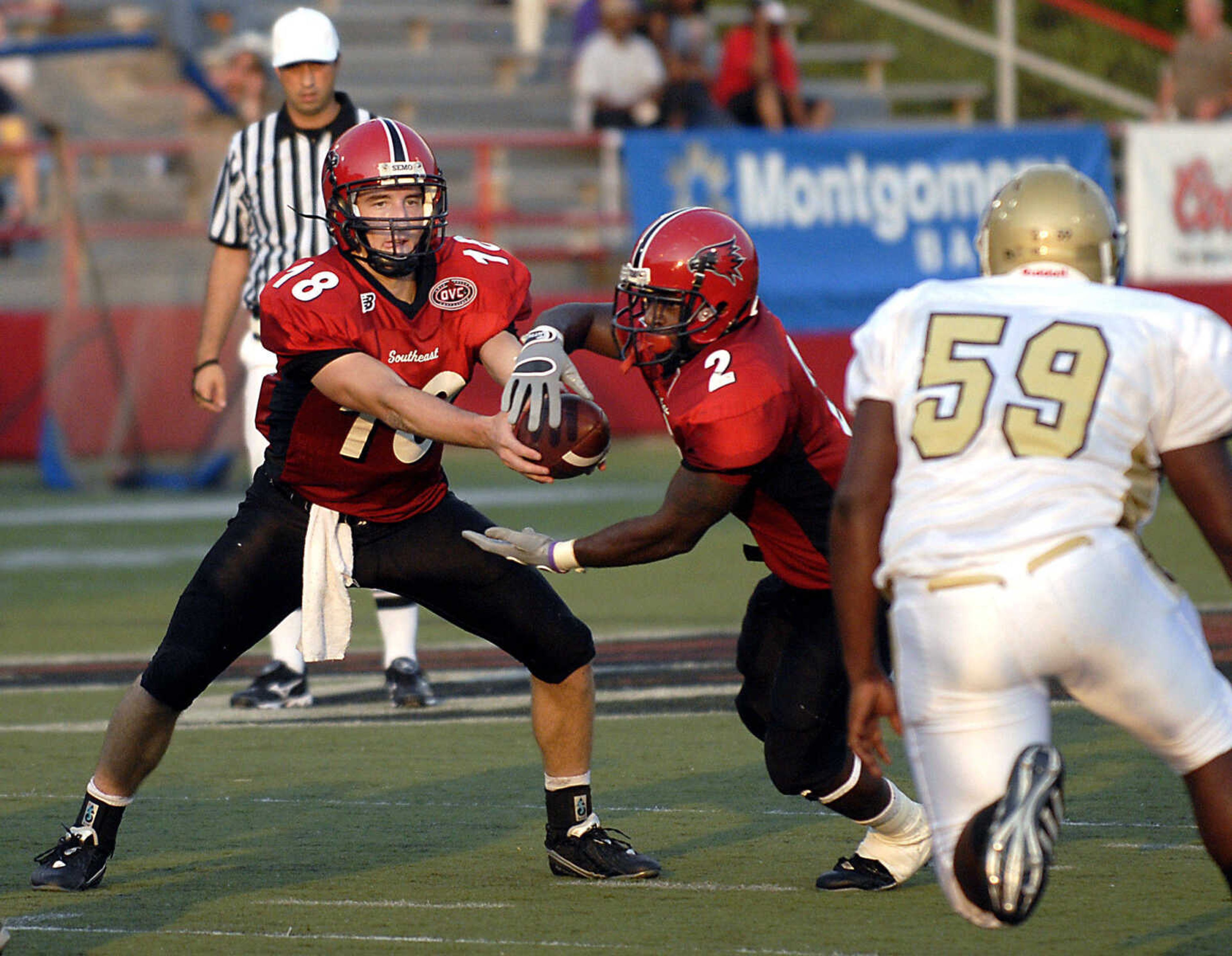 KIT DOYLE ~ kdoyle@semissourian.com
Matt Scheible hands off to Henry Harris in the first quarter Thursday, September 3, 2009, in the season opener at Houck Stadium.