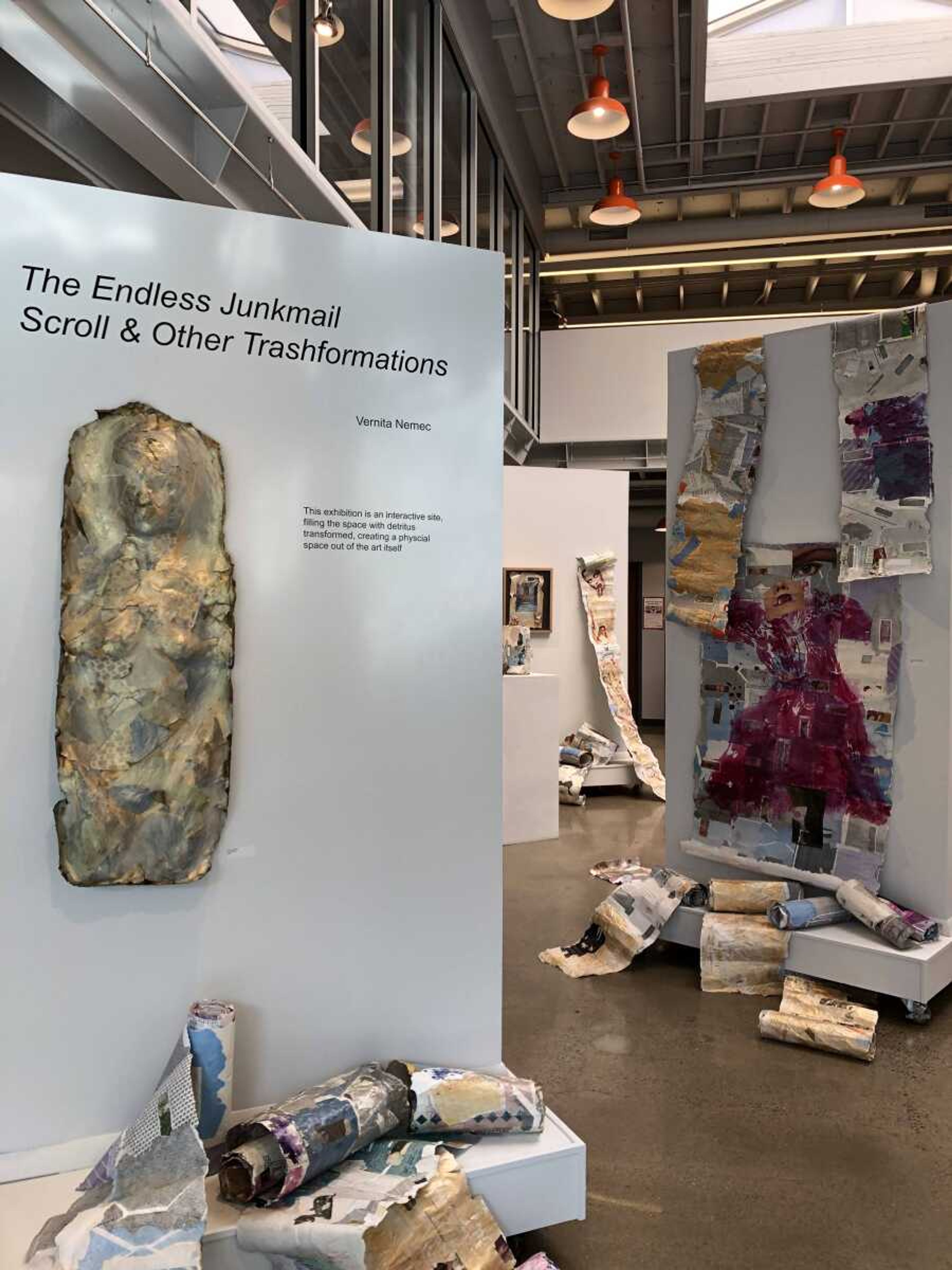 A view of the exhibit at Catapult Gallery. On the left, a 3-D torso created from
junkmail and on the right, A collage of junkmail with monoprinted dress. 