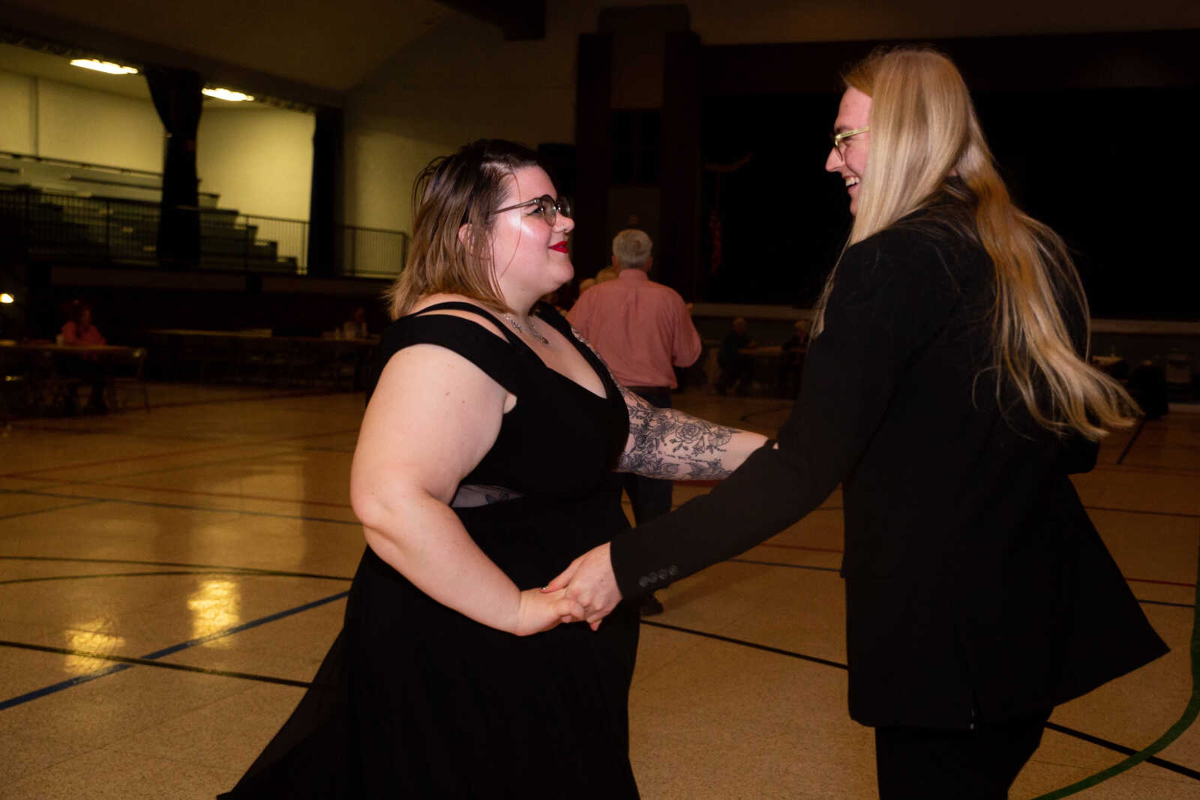 Sarah Russell and Bennett Turner dance together.