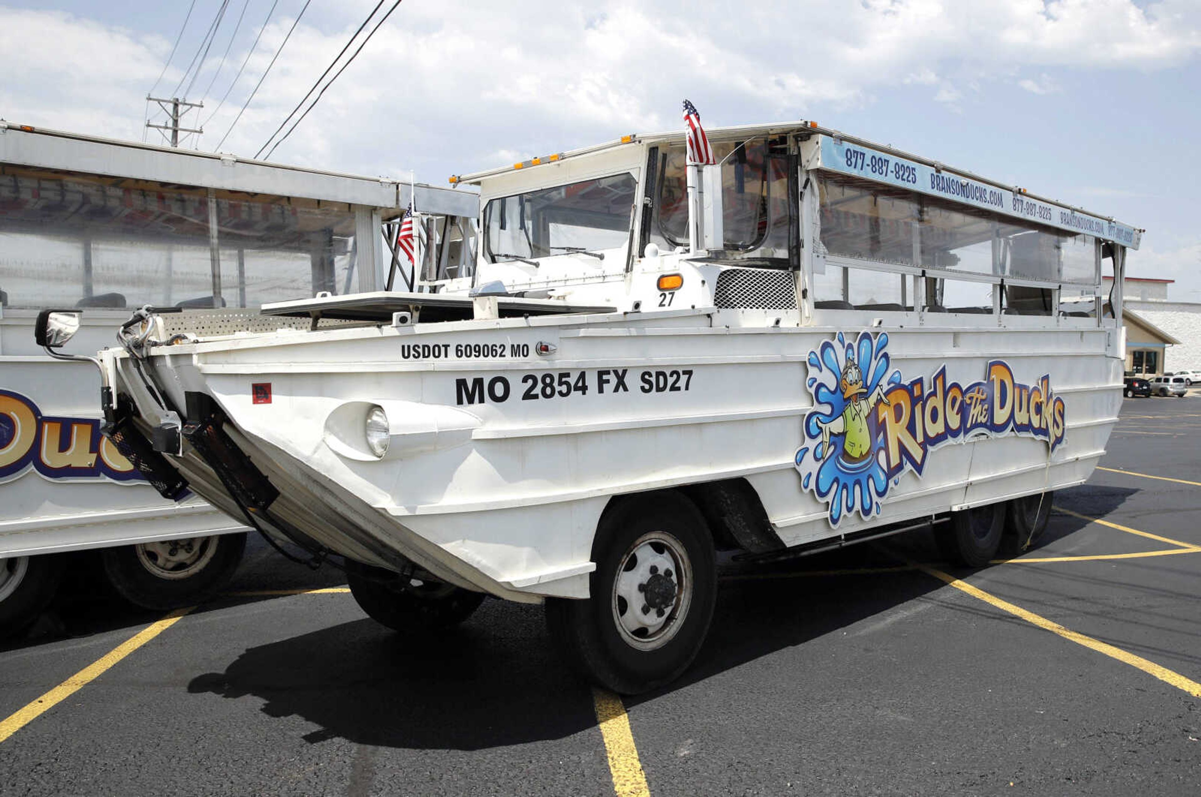 A duck boat sits idle Friday in the parking lot of Ride the Ducks, an amphibious tour operator in Branson, Misosuri. The amphibious vehicle is similar to one of the company's boats that capsized Thursday on Table Rock Lake resulting in 17 deaths.