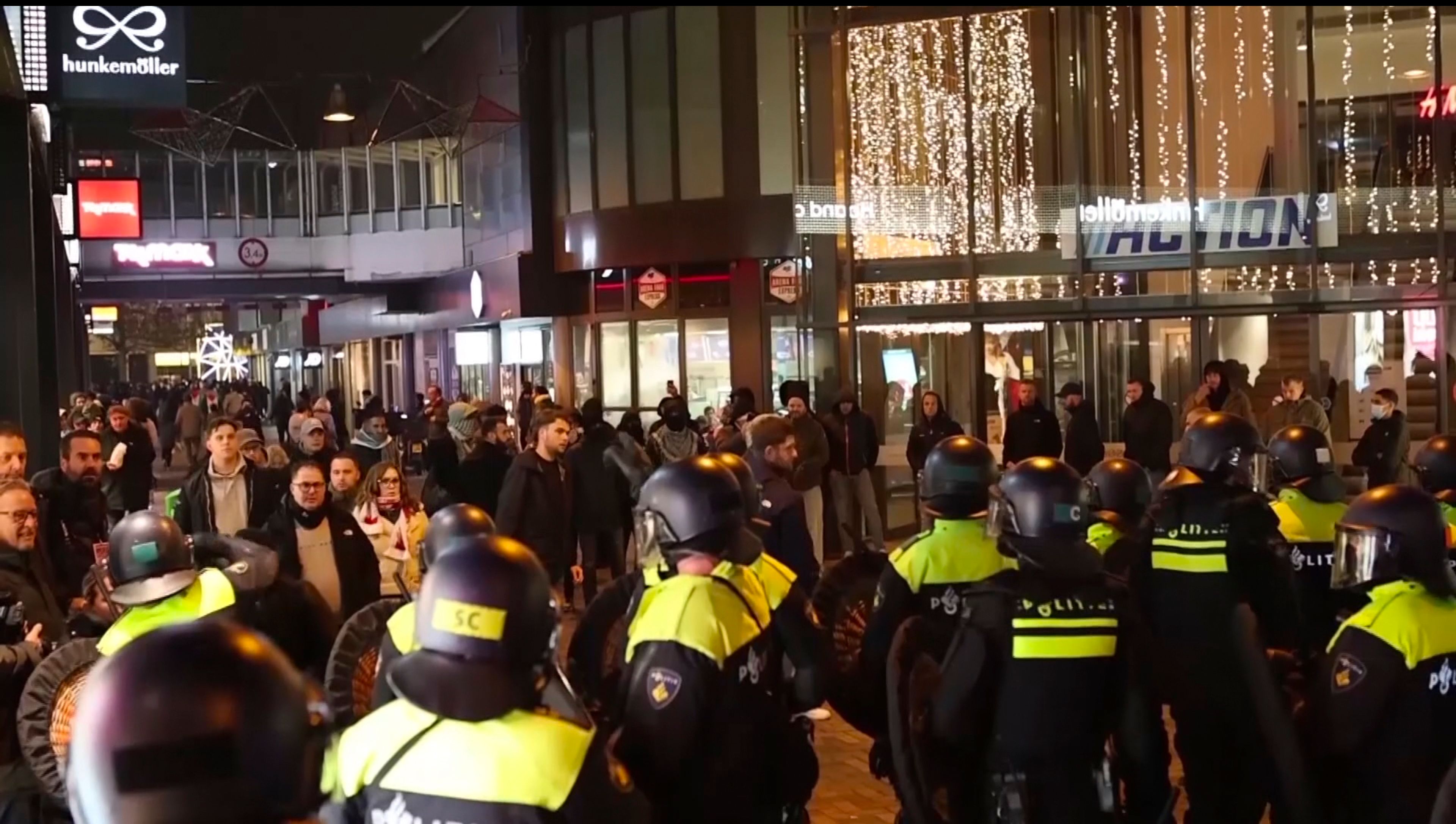 In this image taken from video, police stand guard forming a line near the Ajax stadium, in Amsterdam, the Netherlands, Thursday, Nov. 7, 2024. (AP Photo InterVision)