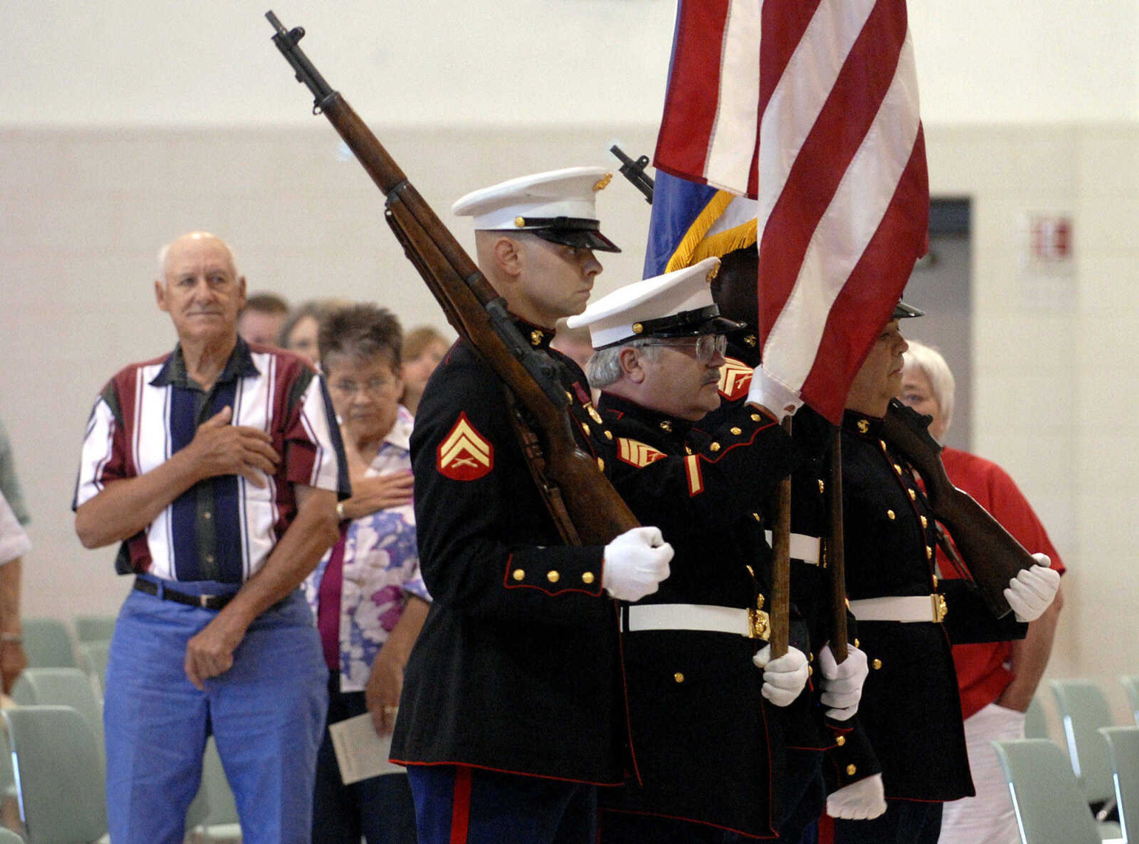 LAURA SIMON~lsimon@semissourian.com
Members of Marine Corps League 1081 posts the colors during the Memorial Day service Monday, May 30, 2011 at the Osage Centre in Cape Girardeau.