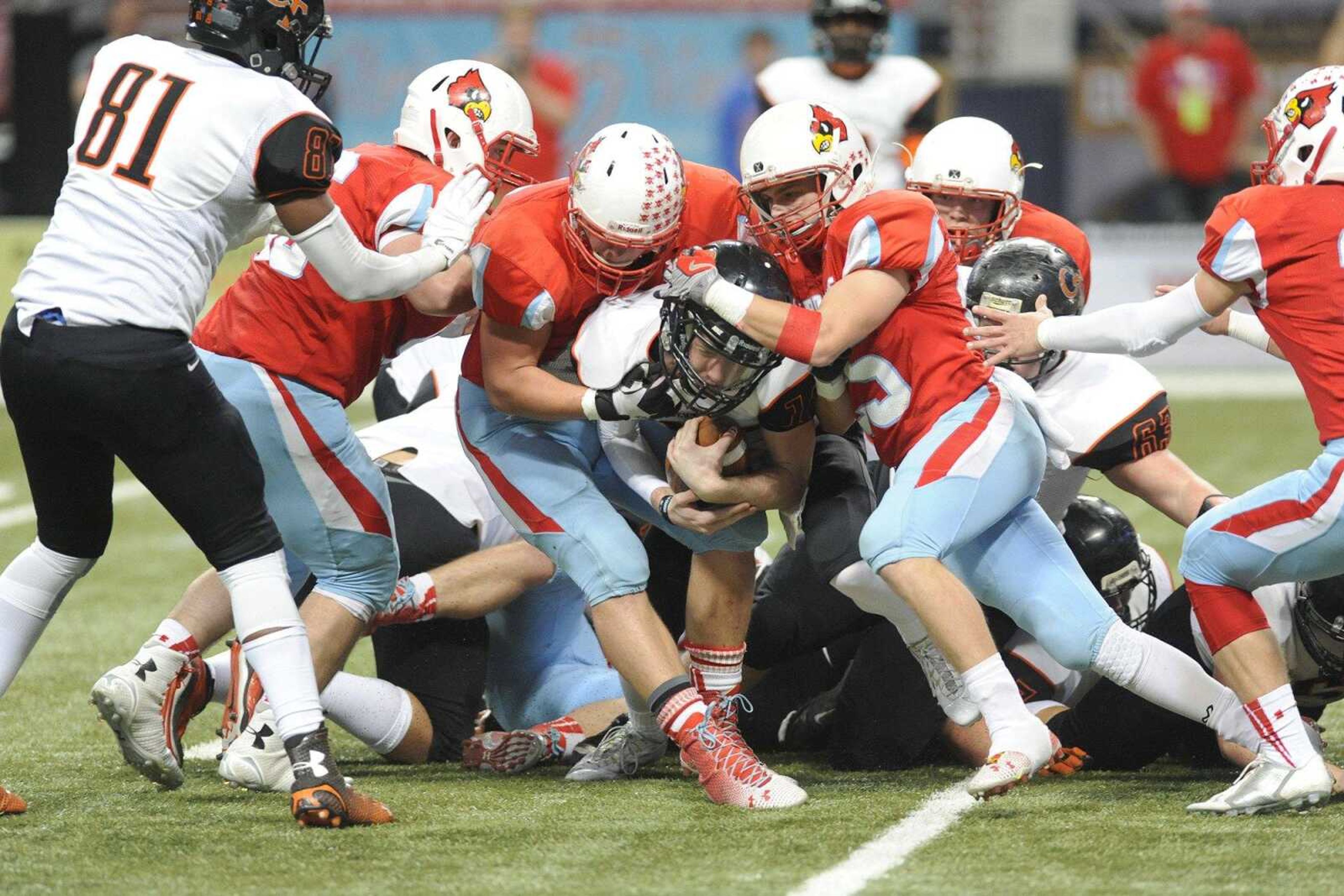 Central s Peyton Montgomery is brought down by Webb City defensive players during the first quarter in the Class 4 state championship Saturday, Nov. 29, 2014 at the Edward Jones Dome in St. Louis. (Glenn Landberg)