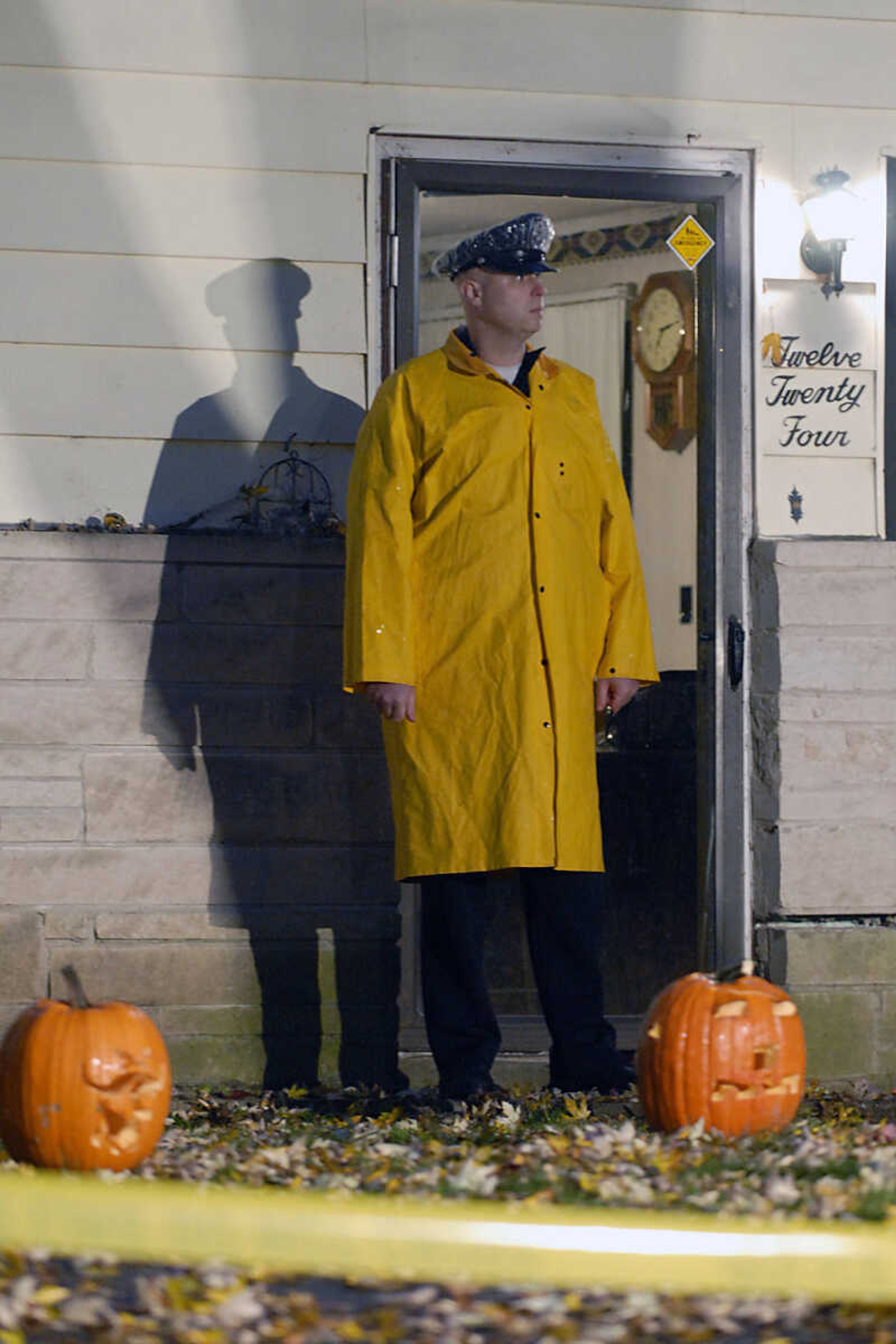 KIT DOYLE ~ kdoyle@semissourian.com
Cape Girardeau policeman Aaron Brown stands in front of 1224 N. Missouri St., the scene of a double homicide near Capaha Park early Tuesday morning.