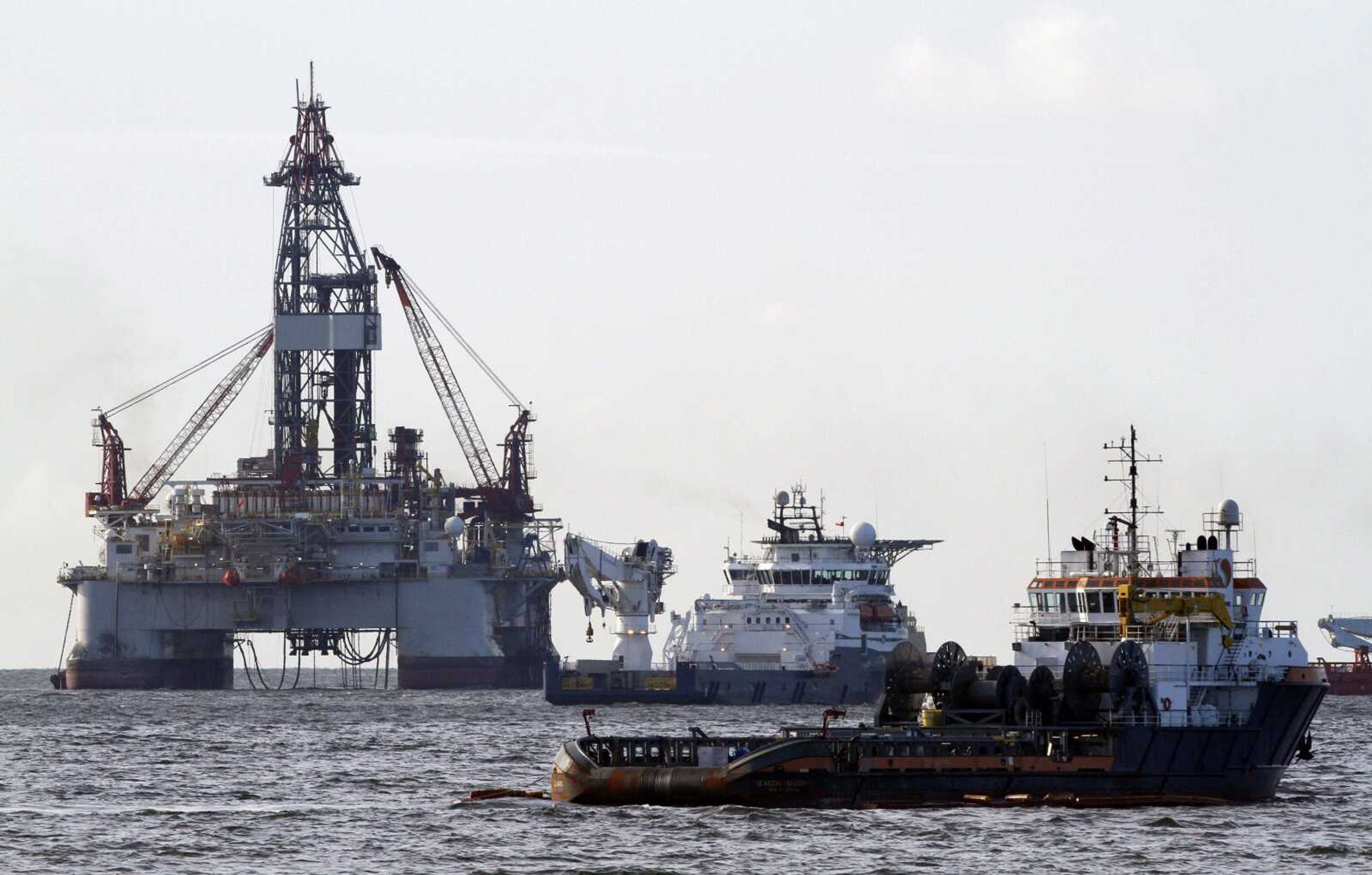 Vessels assisting in the capping of the Deepwater Horizon oil wellhead are seen on the Gulf of Mexico near the coast of Louisiana Friday, July 16, 2010. (AP Photo/Patrick Semansky)