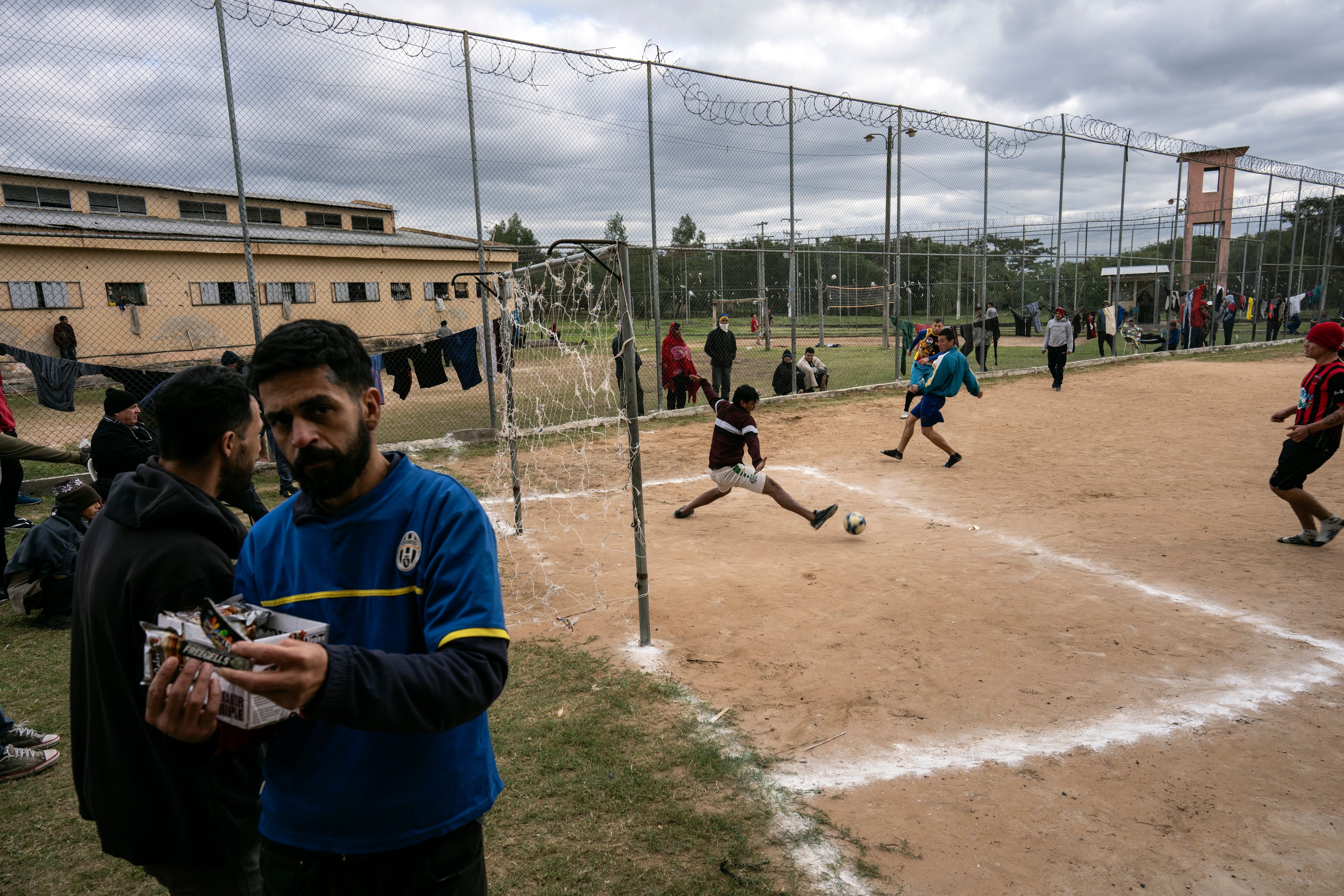 Prisoners play soccer at the Juan de la Vega prison in Emboscada, Paraguay, Friday, July 12, 2024. (AP Photo/Rodrigo Abd)