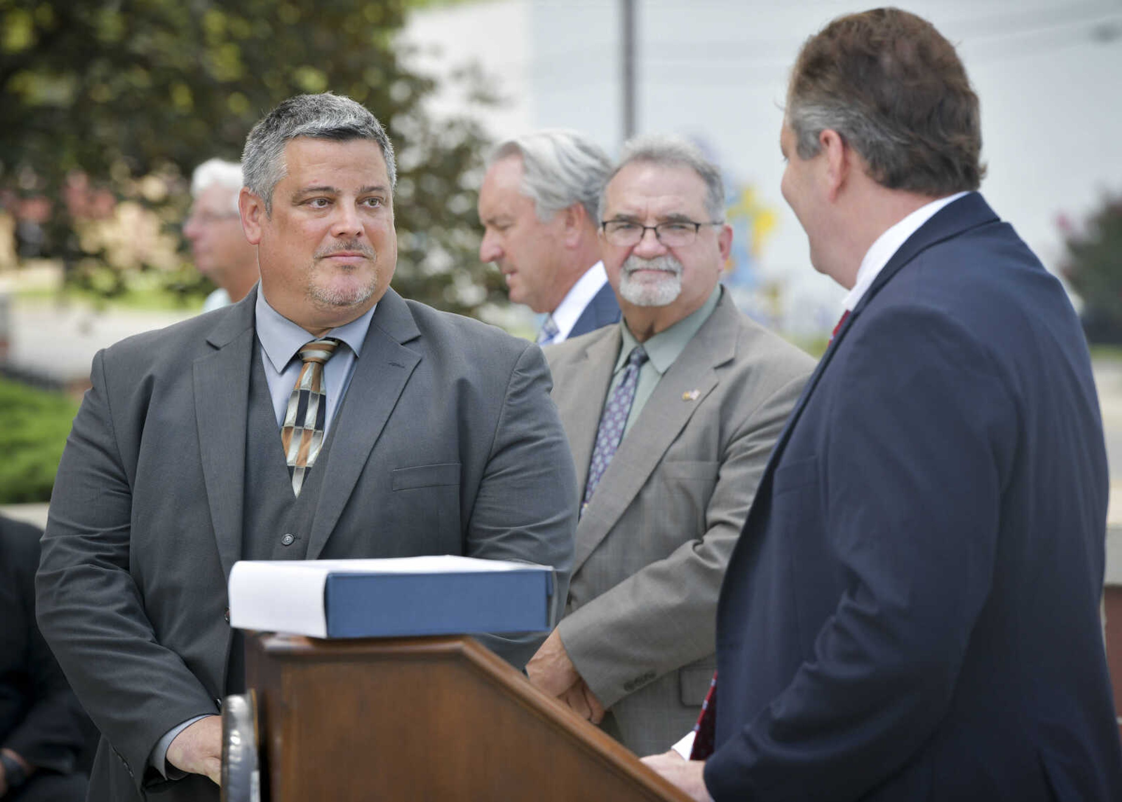 Deputy U.S. Marshal H. Cameron Thuirer, left, is recognized during a ceremony Thursday, July 9, 2020, at the Rush Hudson Limbaugh Sr. Federal Courthouse in Cape Girardeau to honor the seven officers involved in the July 2018 arrest of James O'Dell Johnson in Poplar Bluff.