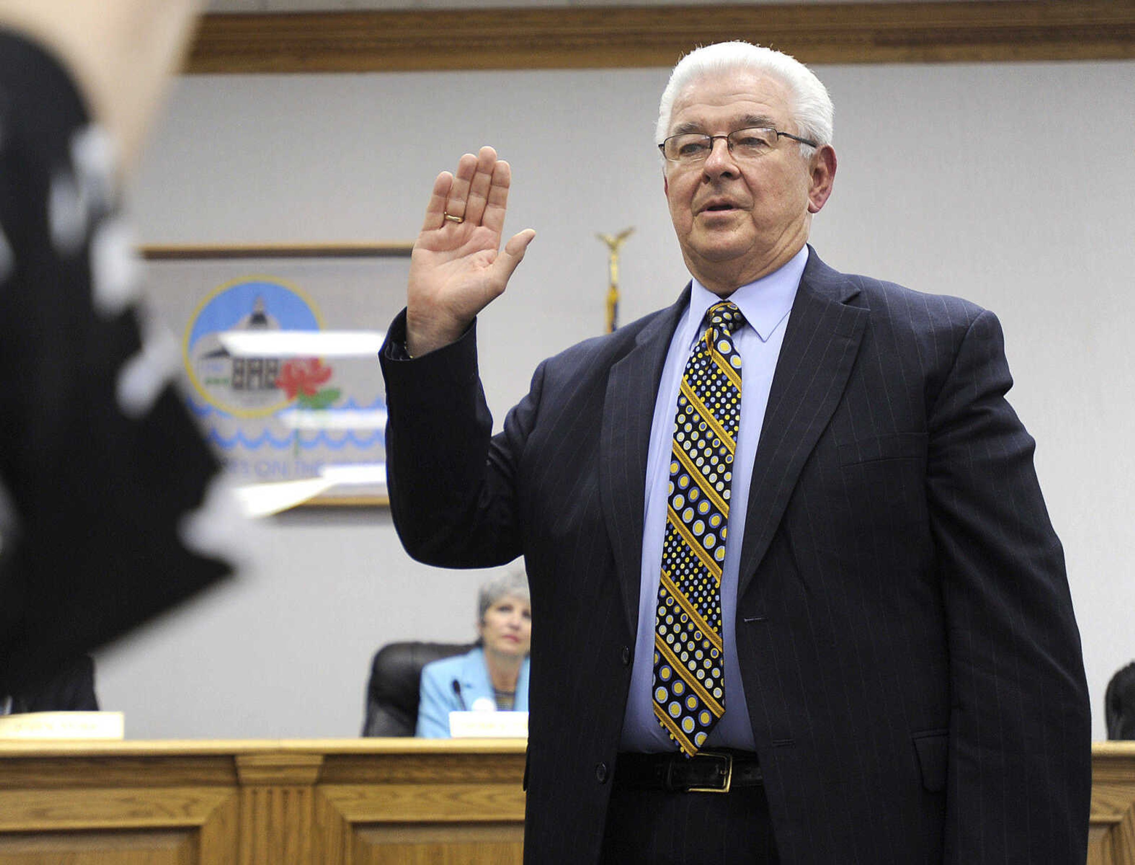 FRED LYNCH ~ flynch@semissourian.com
Harry Rediger takes the oath of office as mayor of Cape Girardeau on April 9, 2010 at city hall. Rediger succeeds Jay Knudtson who reached his term limit.