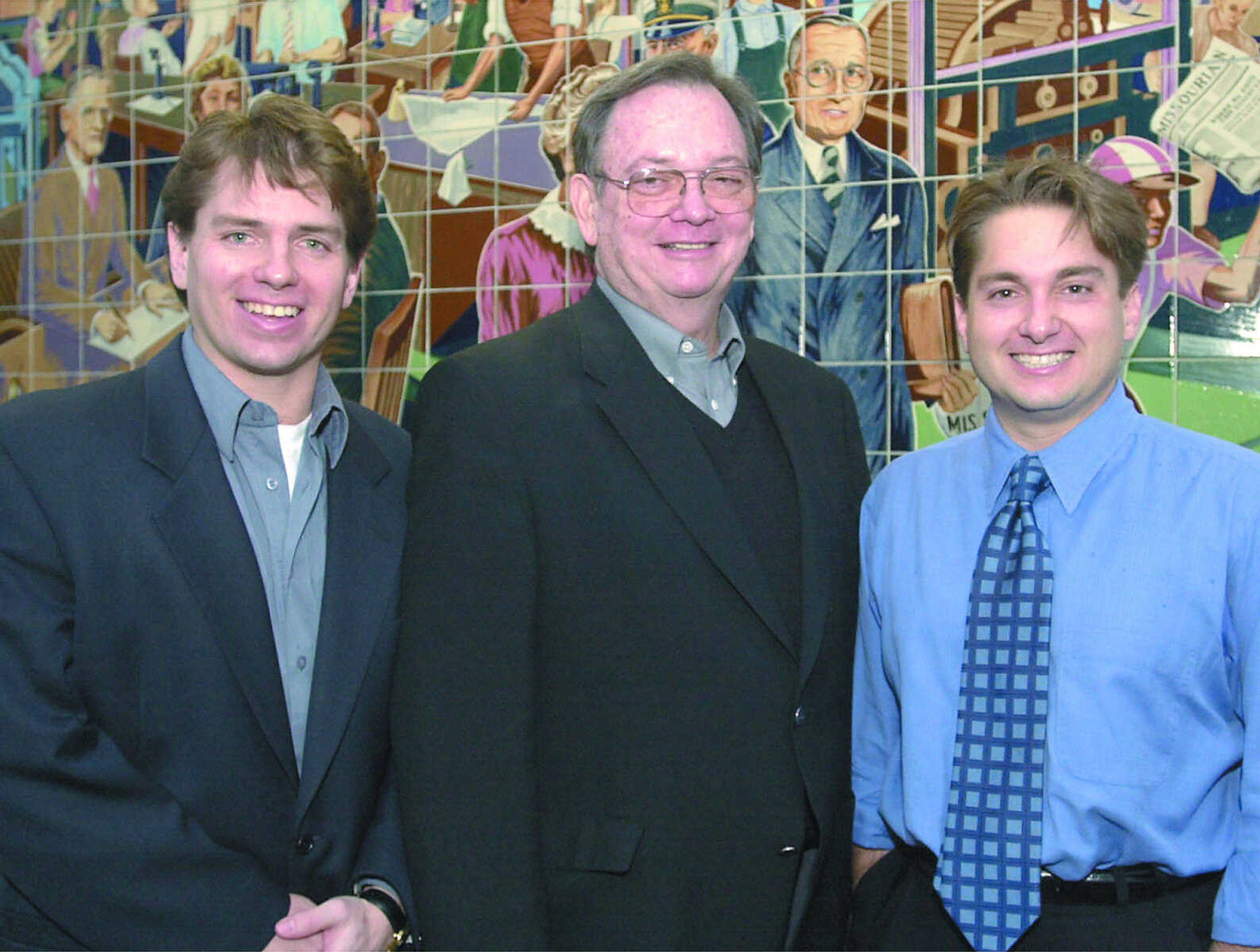 Gary Rust was flanked by his sons, Rex Rust at left and Jon K. Rust at right.