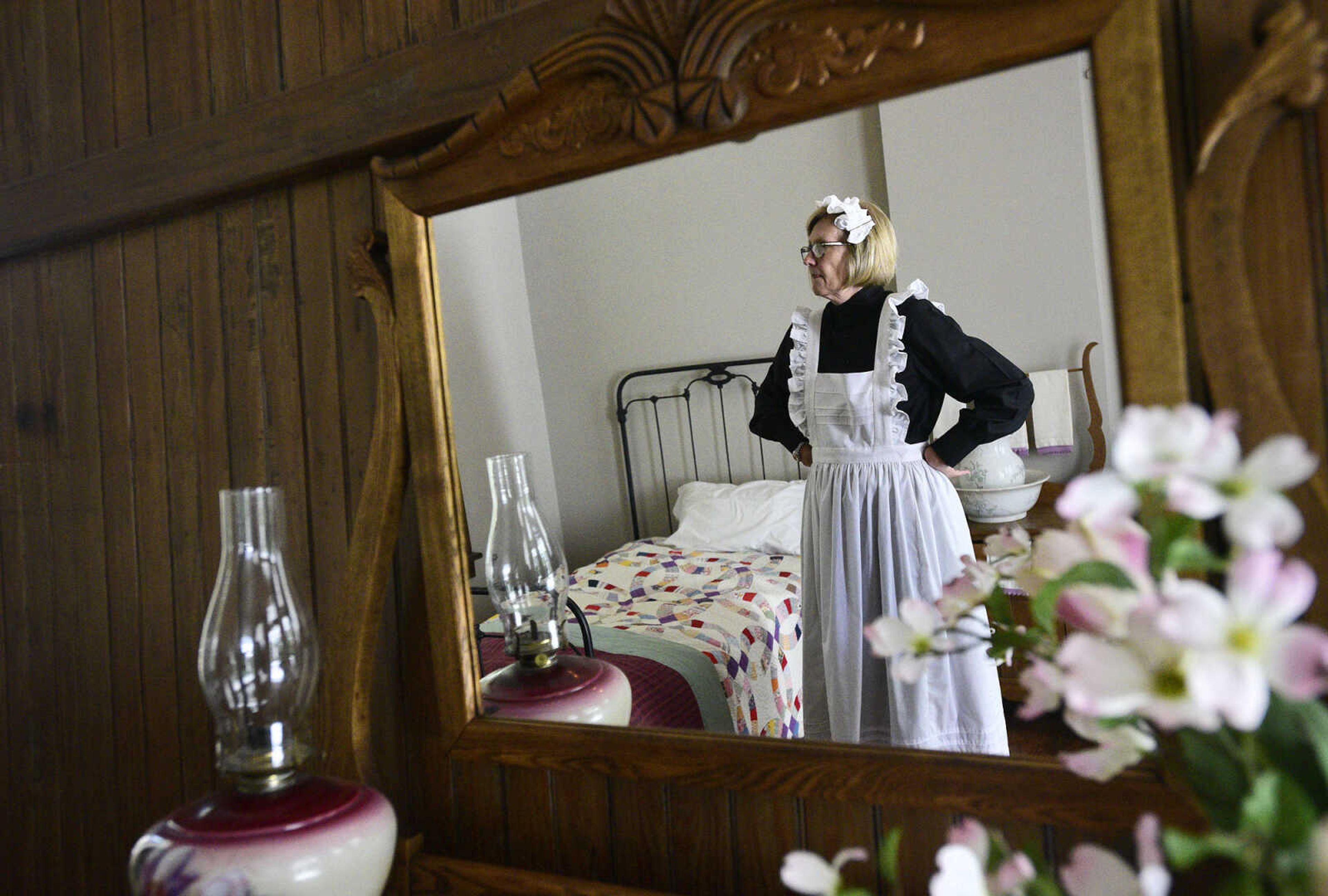 Linda Ingram stands inside the servant's quarters, dressed in period costume, on Wednesday, Aug. 16, 2017, at the Glenn House in Cape Girardeau. KMOS-TV, a PBS affiliate, was filming inside the historic home for its Missouri Life show.