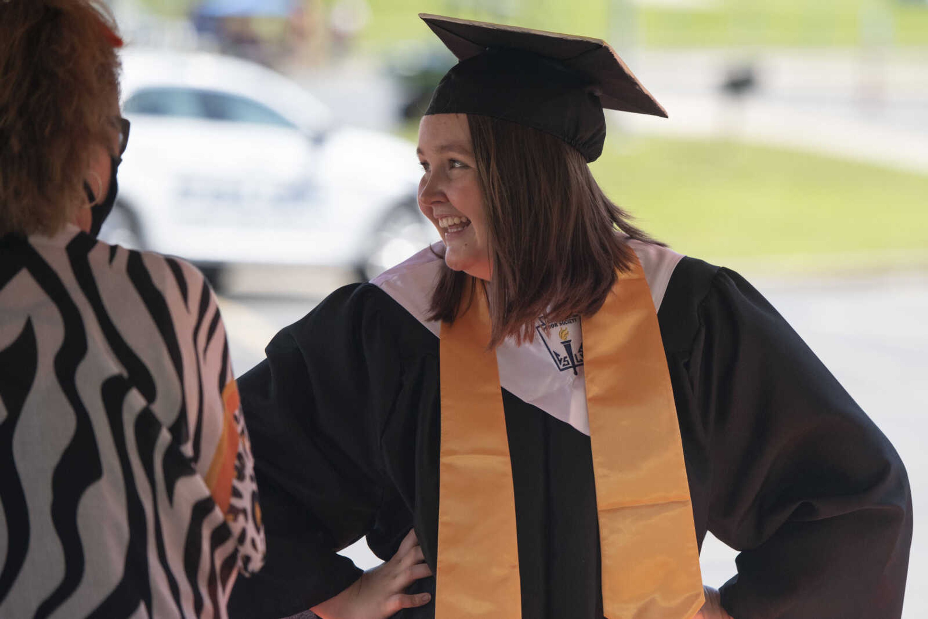 Graduate Randee Beth Graham smiles while waiting to walk across the stage during a drive-through graduation ceremony Saturday, June 13, 2020, at Cape Girardeau Central High School in Cape Girardeau.