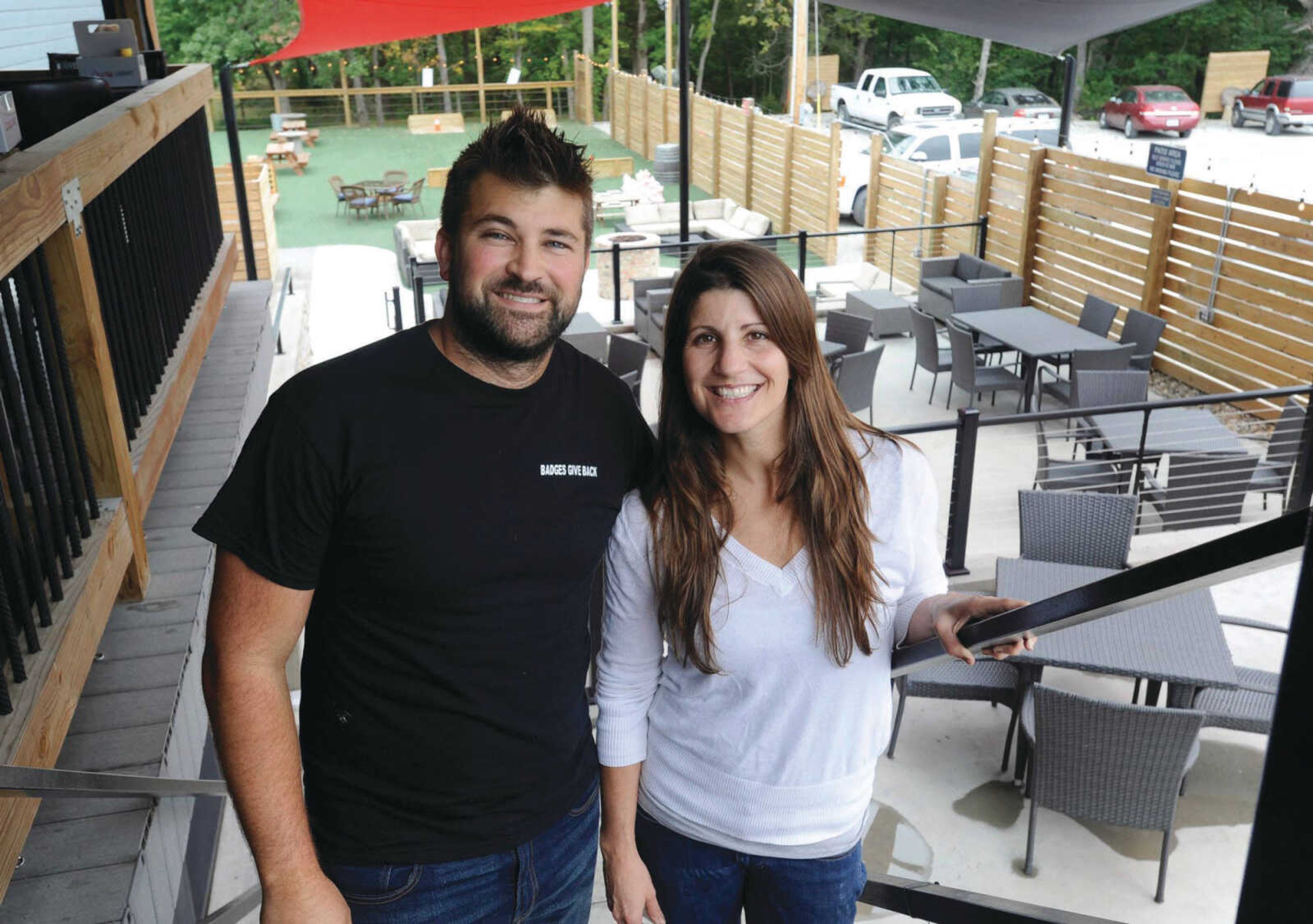 Headline Bold:Eric Clements and Cara Naeger pose for a photo at the Dew Drop Inn on Sept. 12 in Bloomsdale, Missouri.